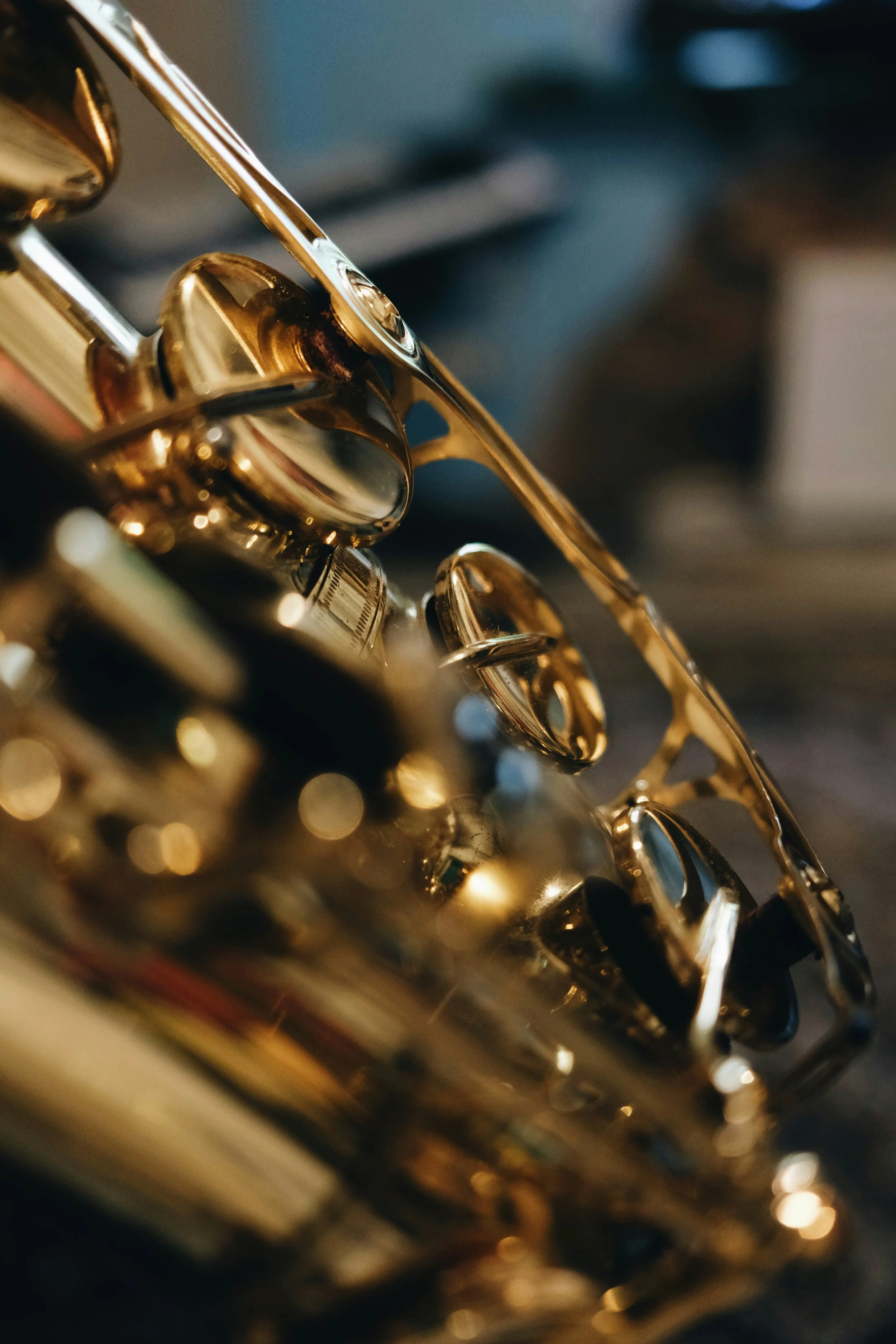 Close-up of a gold-colored saxophone with shiny keys and mechanisms.