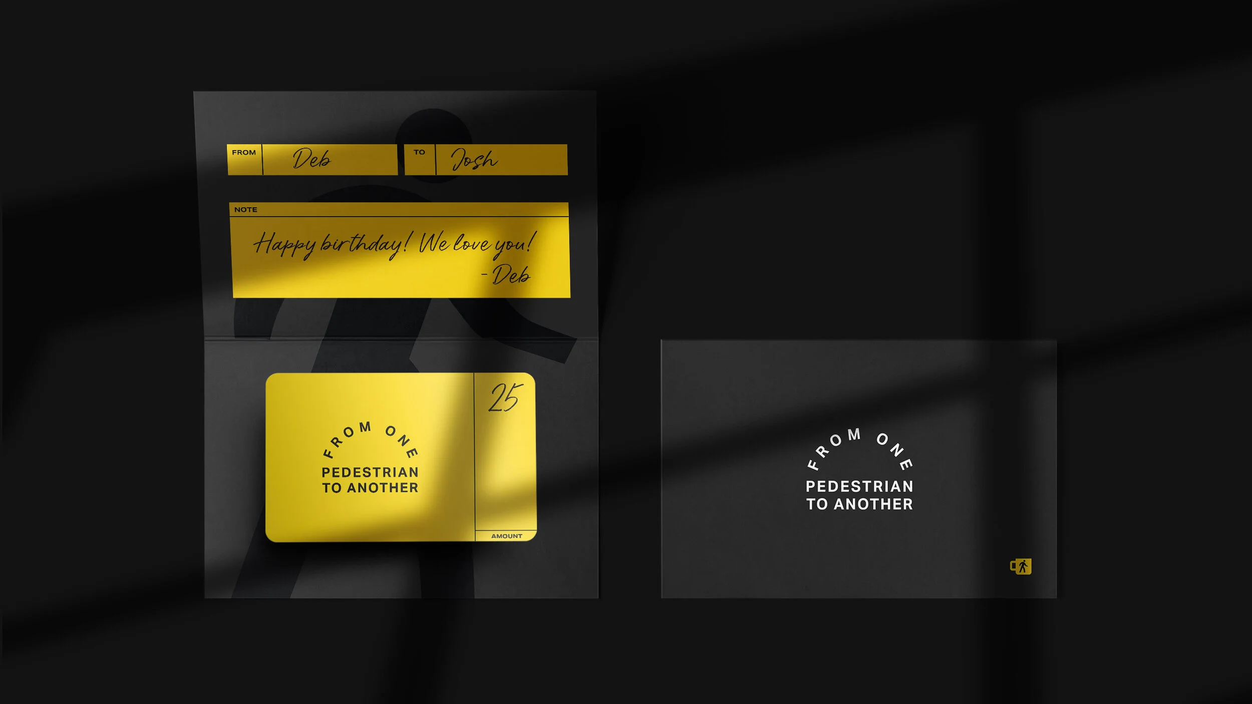 A black and gray poster with yellow sticky notes. One note contains a handwritten message: 'Happy birthday! We love you! - Deb'. The poster also has printed notes indicating 'FROM', 'TO', and 'NOTE'. The number 25 is visible on a yellow sticker, and 