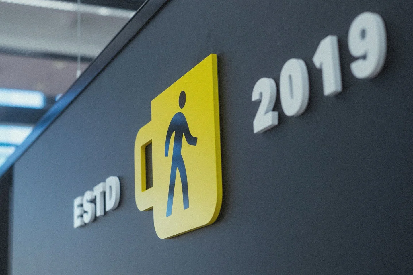 Sign with a walking figure and the words 'STOP' and '2019'