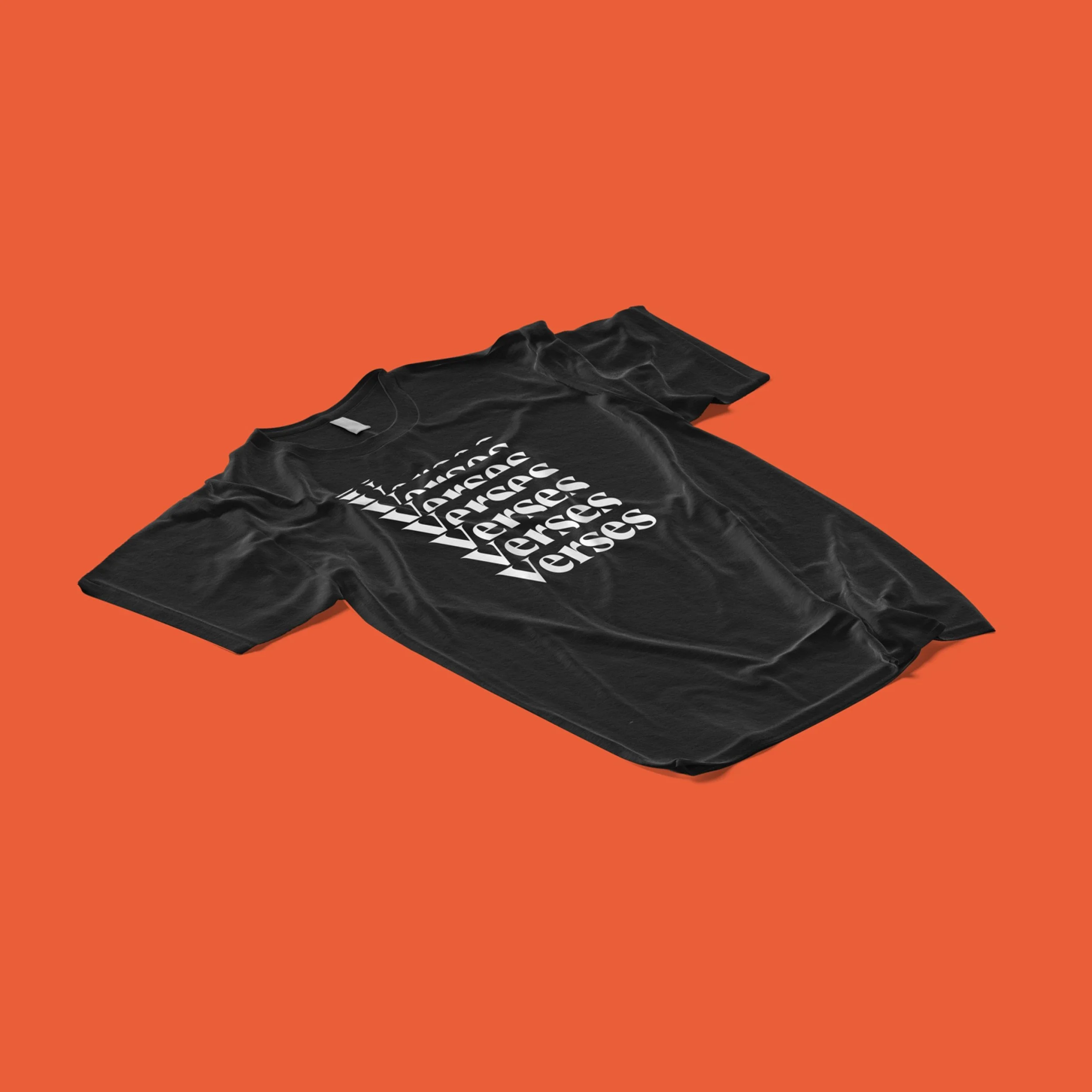 A black T-shirt with white text and a small white Nike swoosh logo on a bright orange background.