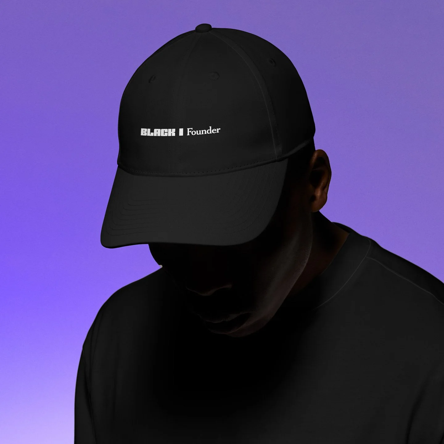 A person wearing a black baseball cap with the words 'BLACK 1 Founder' embroidered on the front, a black shirt, and against a purple background.