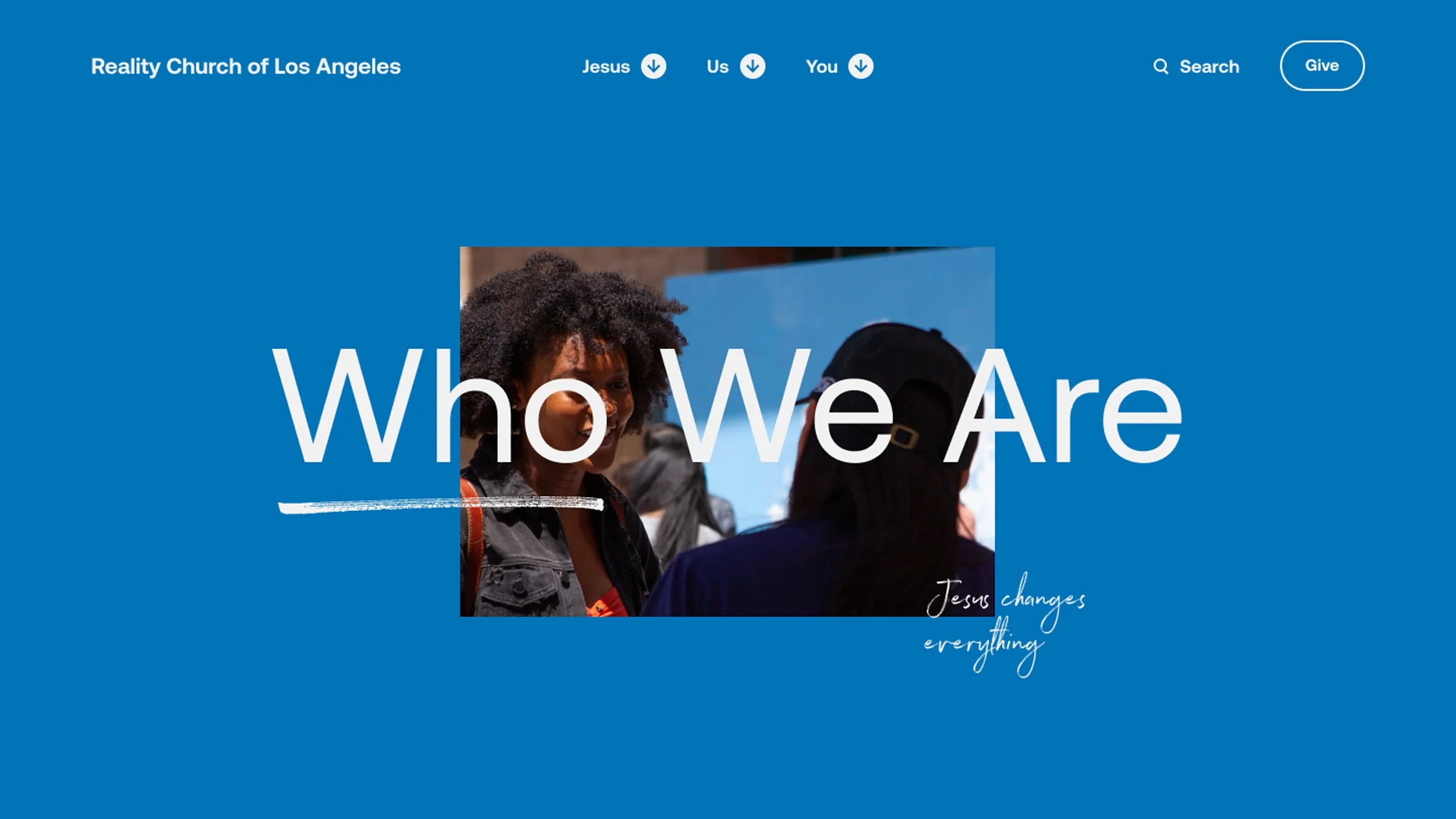 Screenshot of the homepage of the Reality Church of Los Angeles featuring a woman with curly hair engaging in conversation, with the words "Who We Are" prominently displayed and the phrase "Jesus changes everything" in cursive.