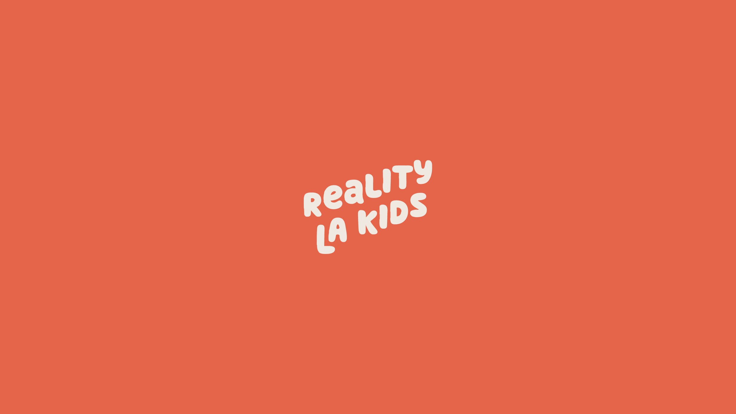 Orange background with centered white text that says 'RealtY Lau Kids'.
