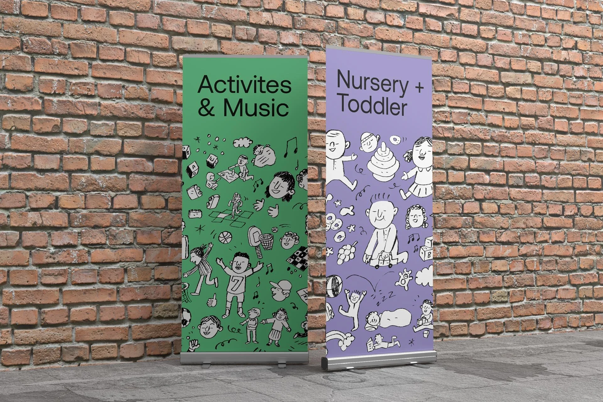 Two colorful vertical banners with cartoon illustrations and text, standing on a sidewalk against a brick wall. The green banner reads 'Activites & Music' with drawings of children, animals, and music notes. The purple banner reads 'Nursery + Toddler' with illustrations of children, animals, and playful scenes.