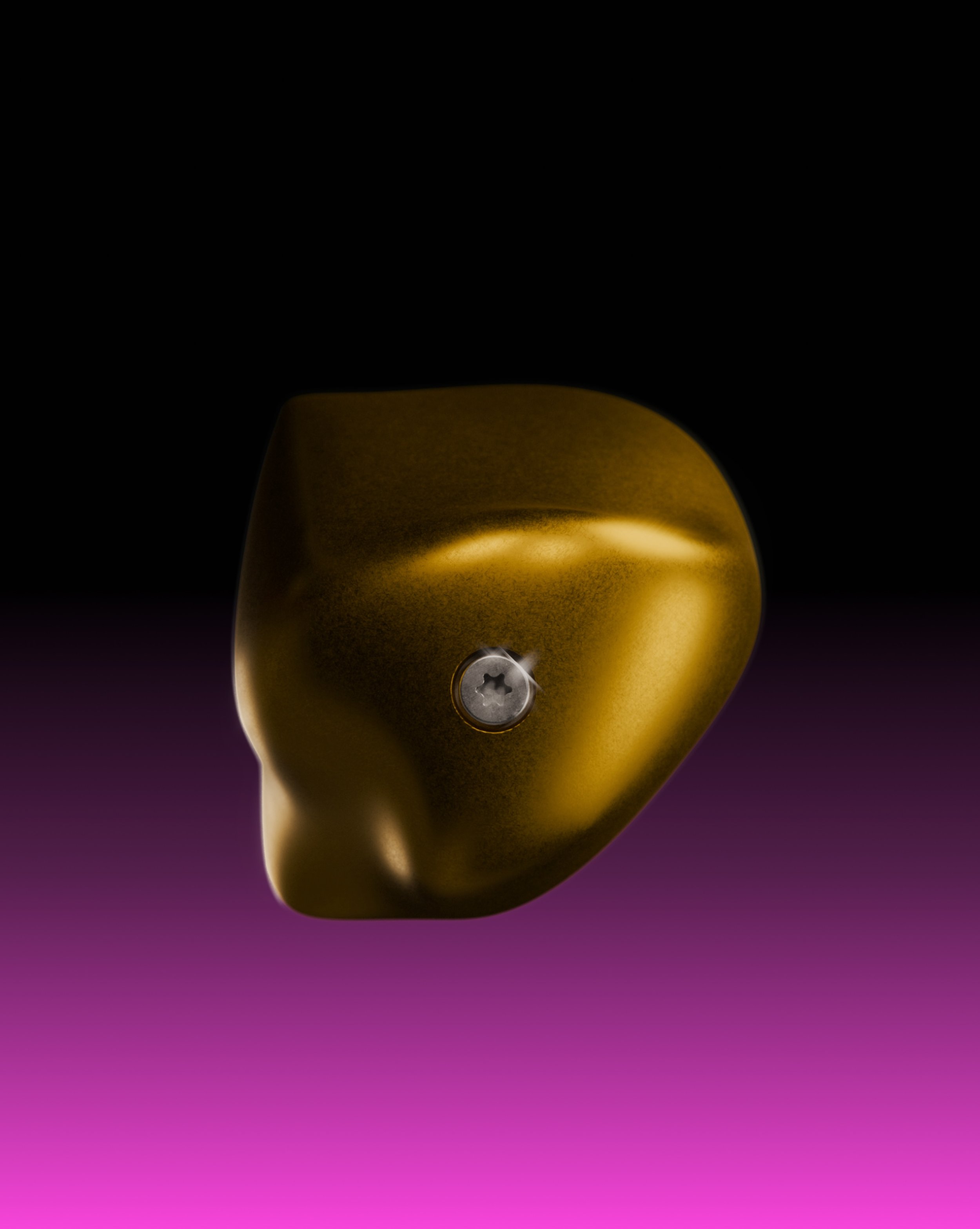 Close-up of a metallic gold-colored object against a dark purple background, with a small central edition.