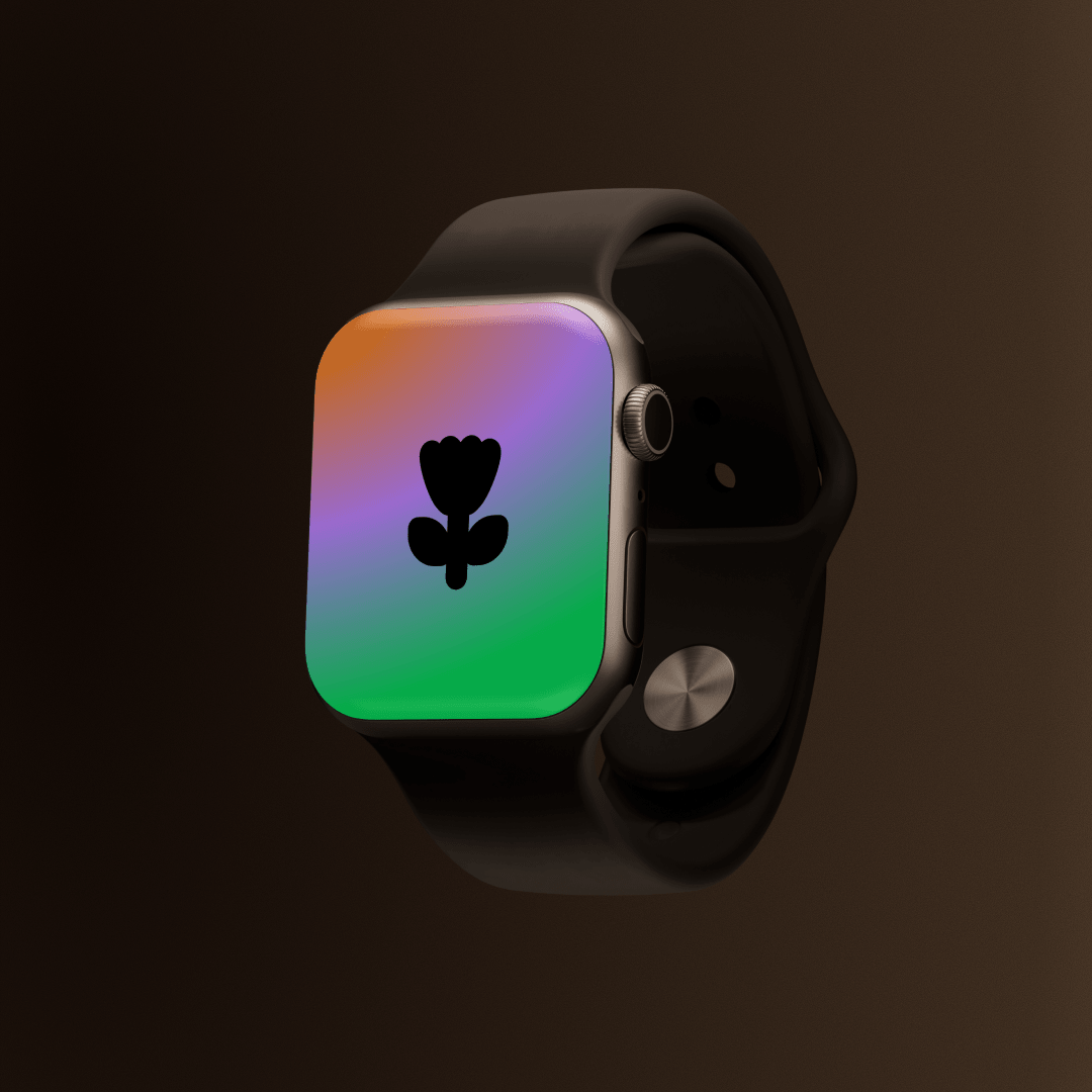 Smartwatch displaying a colorful gradient background with a black flower icon.