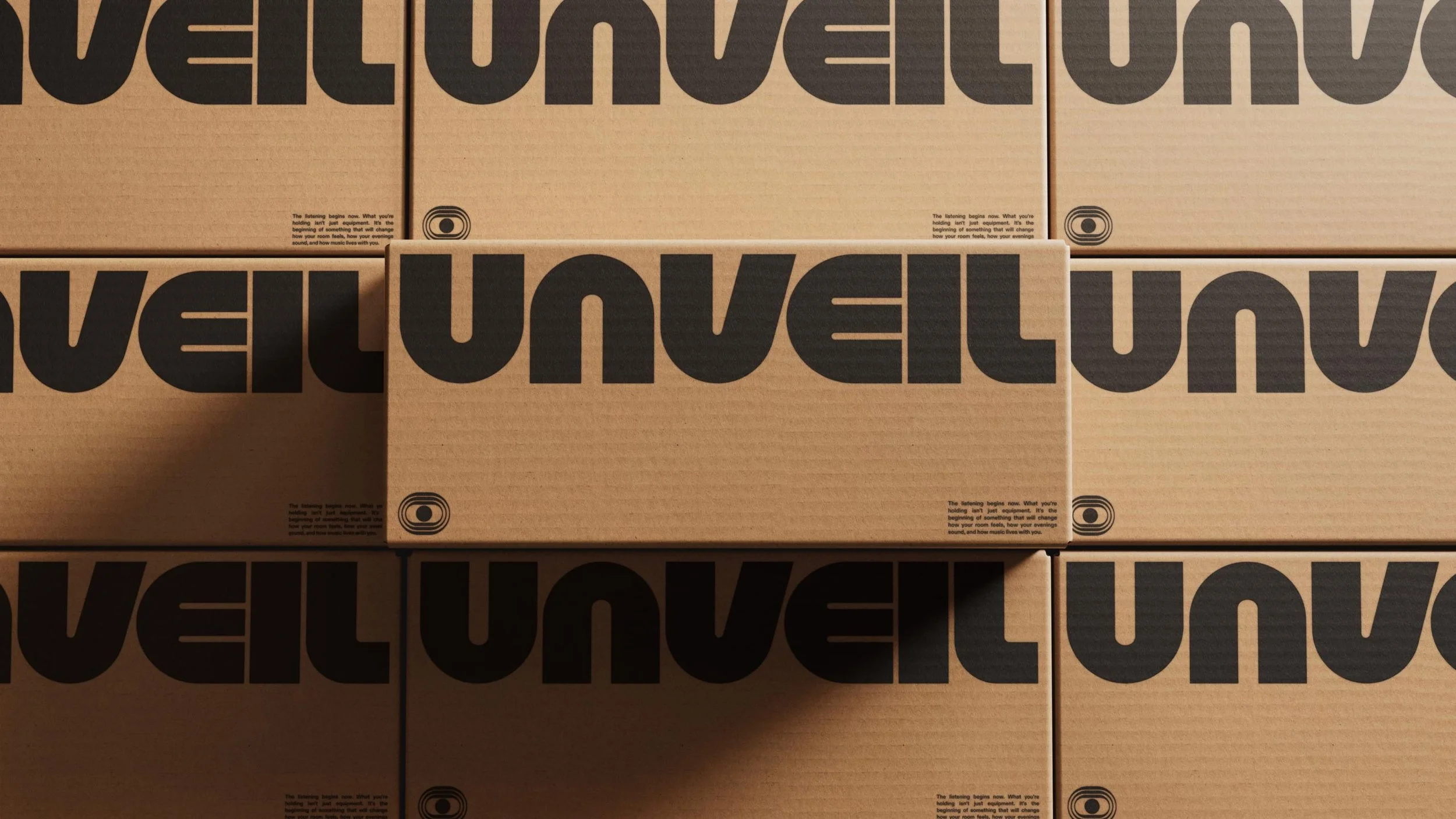 Stacked cardboard boxes with black text and logos on the sides.