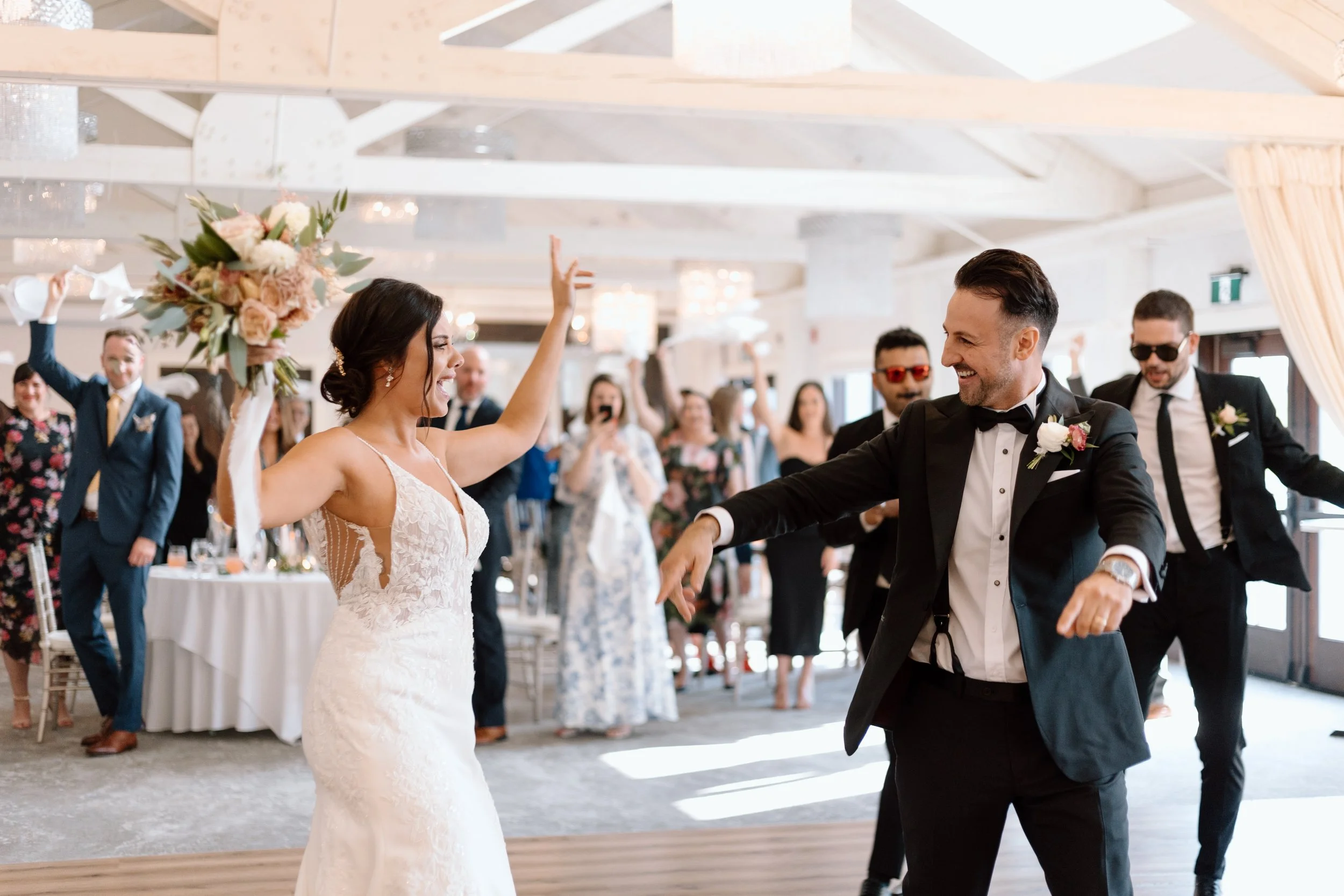 Bride and groom sharing a joyful first dance moment at a wedding reception in the Greater Toronto Area