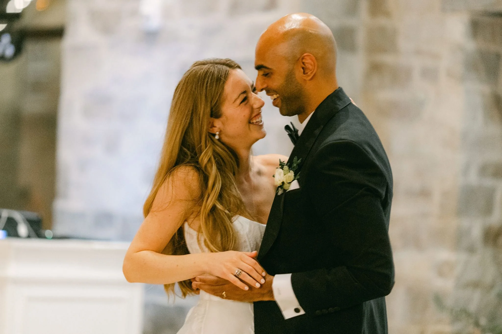 Bride and groom sharing an intimate first dance moment at a wedding reception in the Greater Toronto Area