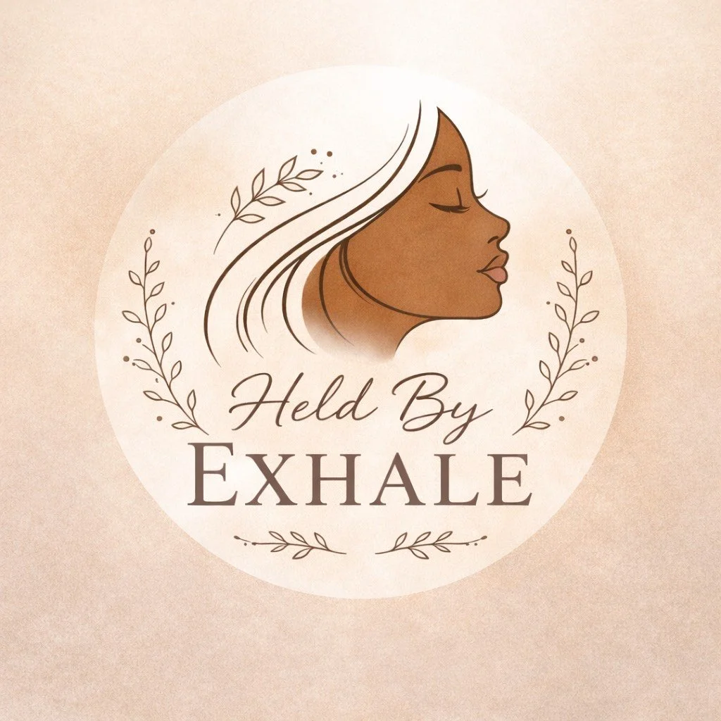 A logo with a side profile of a woman with closed eyes and long hair, surrounded by decorative leaves, and the text 'Held By Exhale' written below.