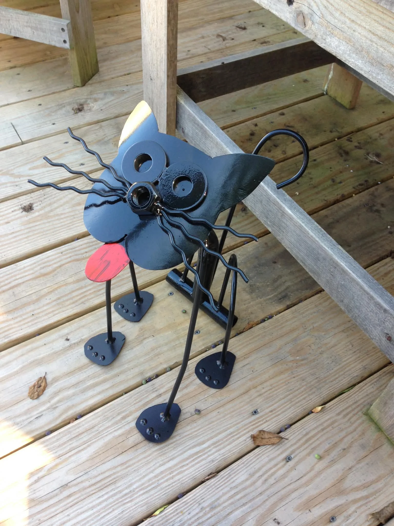 Our hand forged steel cat is crafted in Coinjock, NC using traditional blacksmith techniques. Each piece is individually shaped from solid steel, creating a durable, stable feeding station designed to last for years.

Unlike mass-produced fabrication