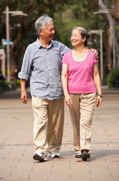 person walking for exercise representing a walking program used to improve circulation in peripheral artery disease