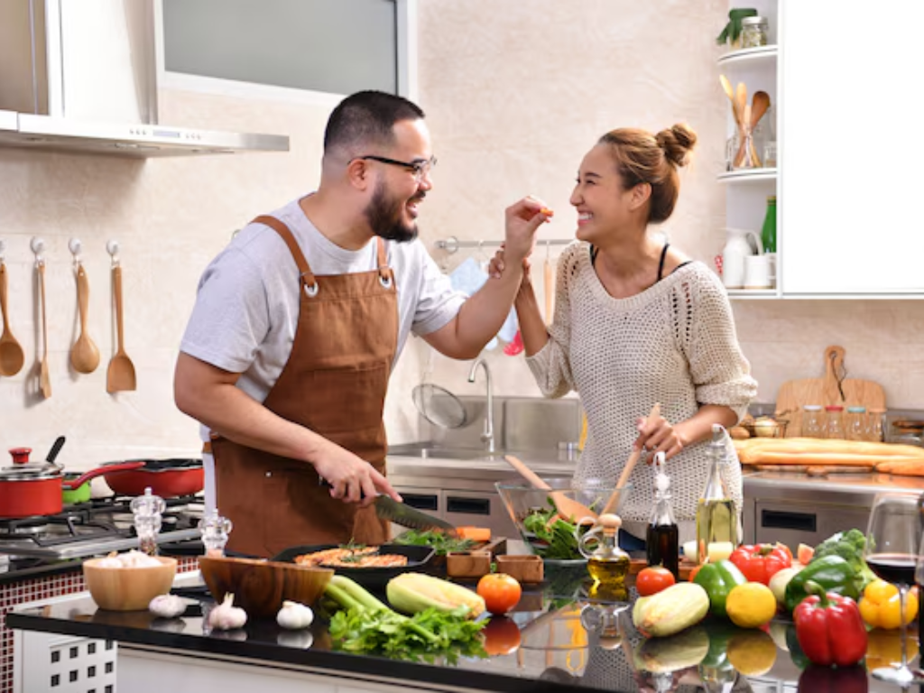 couple preparing healthy vegetables in kitchen representing diet choices that support circulation and vascular health