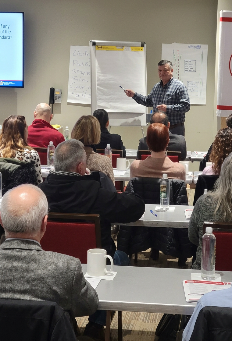 Robinson Vasquez Montes delivering bilingual safety training to construction workers