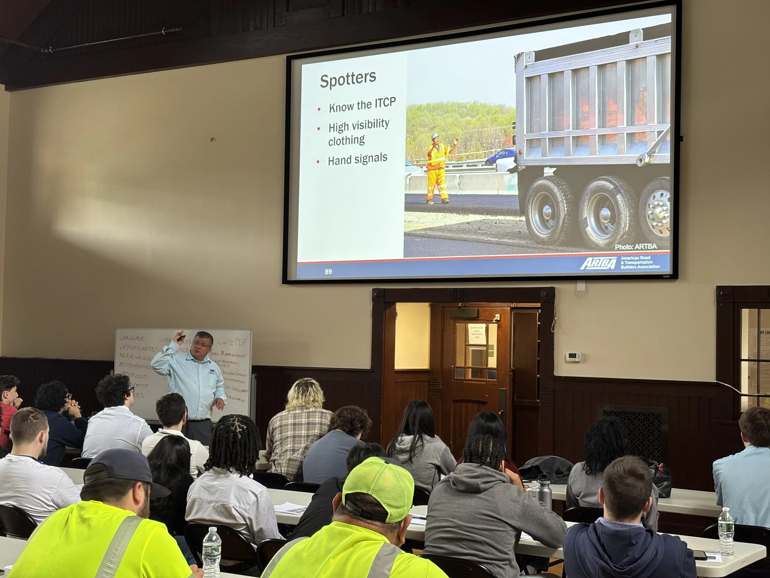 Robinson Vasquez Montes delivering safety training to construction workers