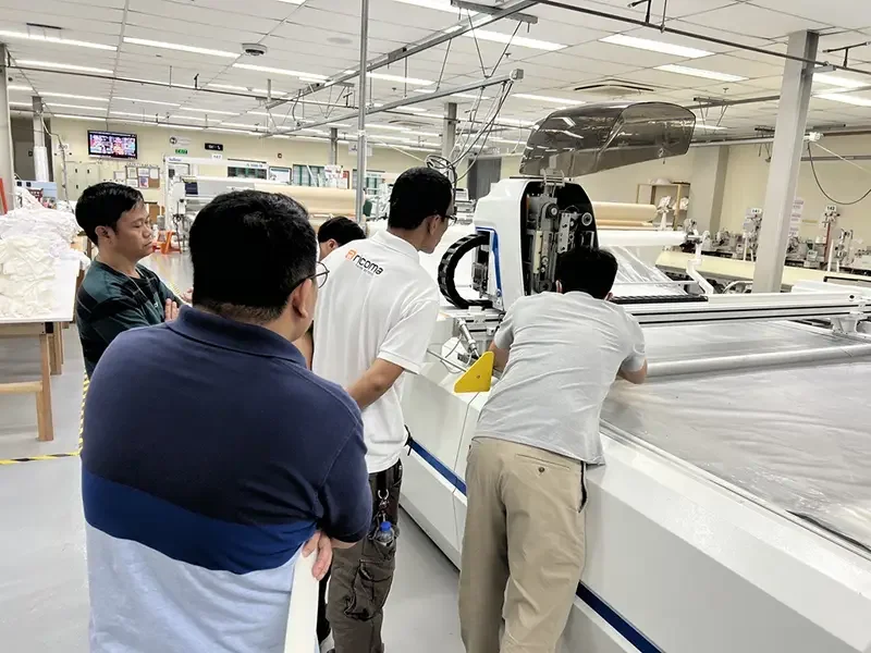 Bleuciel team conducting on-site consultation and technical demonstration of a BULLMER industrial cutting system inside a Philippine manufacturing facility.