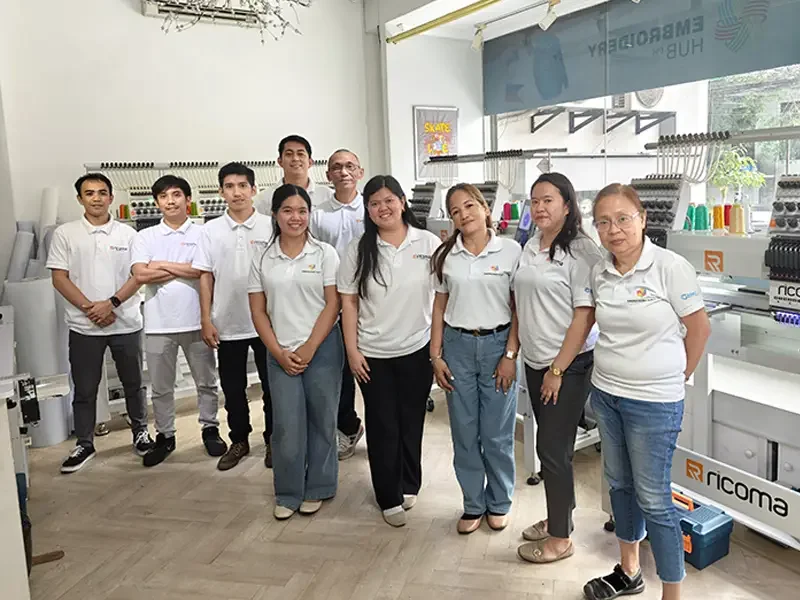 Bleuciel Automations technical team inside their industrial embroidery and sewing machine showroom in the Philippines.