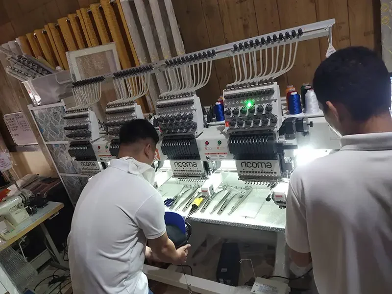 Bleuciel Automations technicians installing and commissioning Ricoma industrial embroidery machines for production use in the Philippines.
