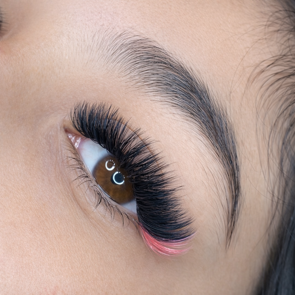 Close-up of mega volume lash extensions and pink highlights at the lash tips. Independence, OR.