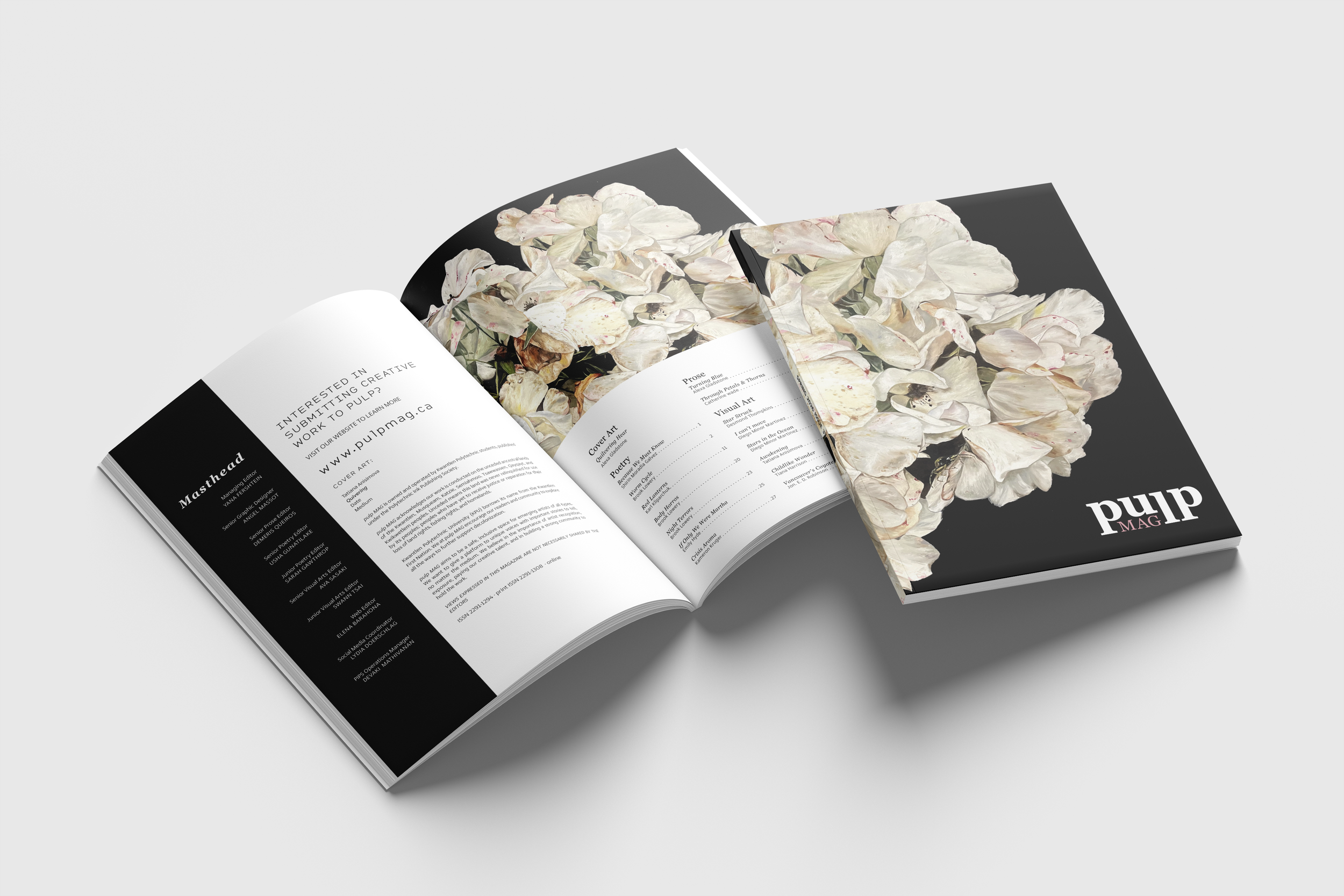 Open magazine with black cover featuring white and pink text, displaying images of white flower petals with hints of pink, on a white background.