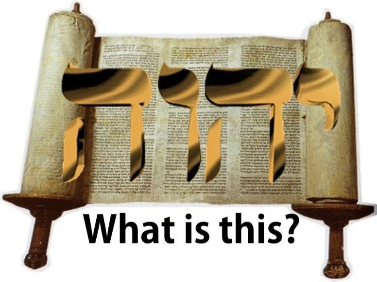 A scroll with the Hebrew word "Torah" cut out in the center and the question "What is this?" written below.