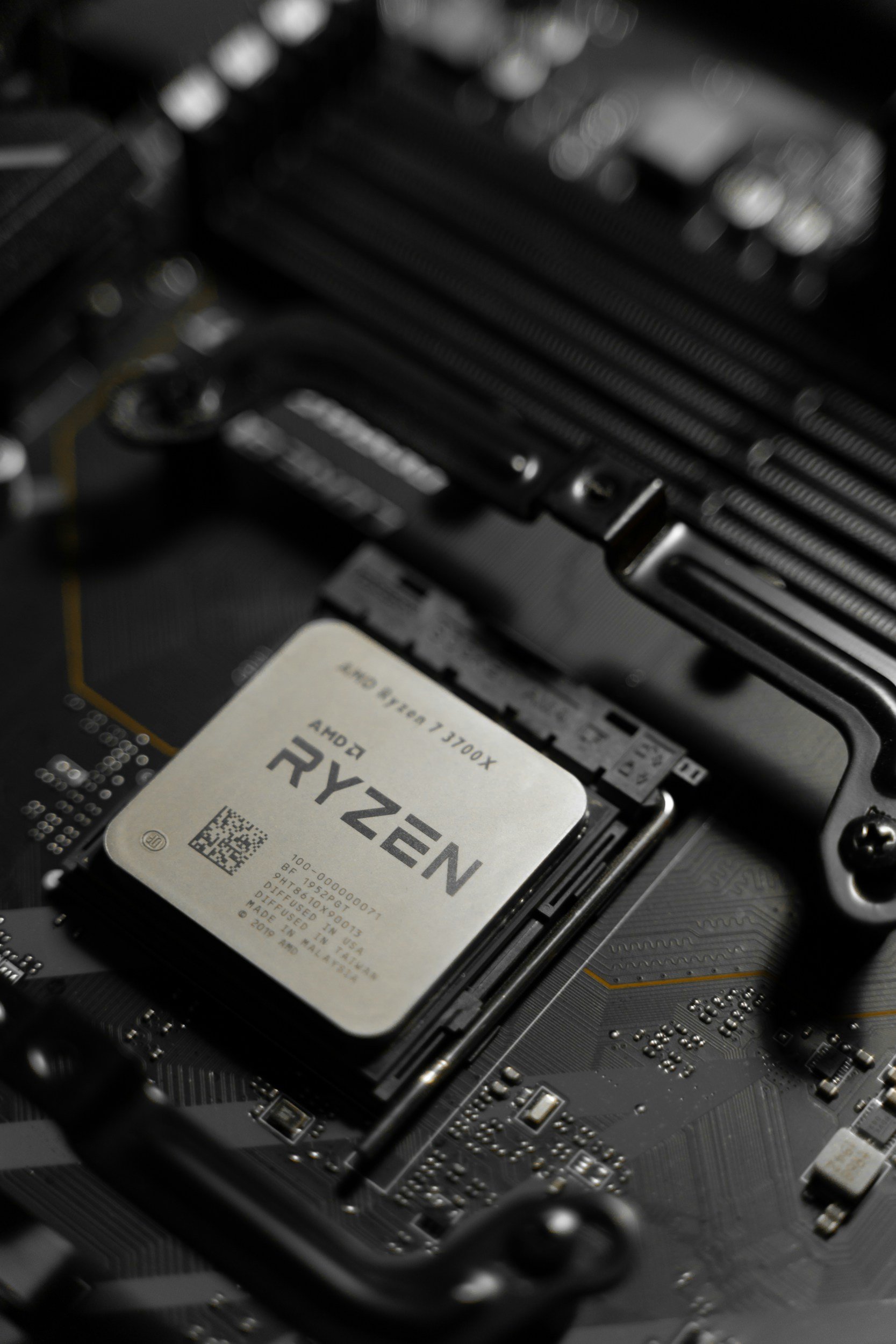 Close-up of a computer motherboard with a Ryzen processor installed.