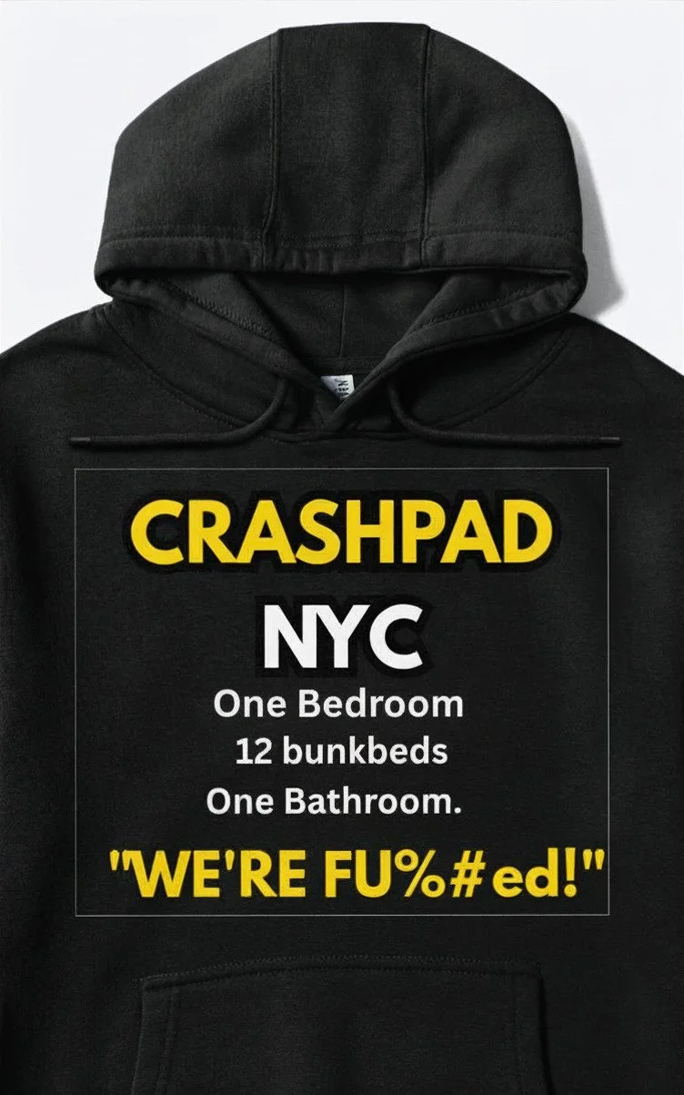A black hoodie with a humorous rental listing text for a small NYC apartment, mentioning one bedroom, 12 bunk beds, one bathroom, and a quote at the bottom.