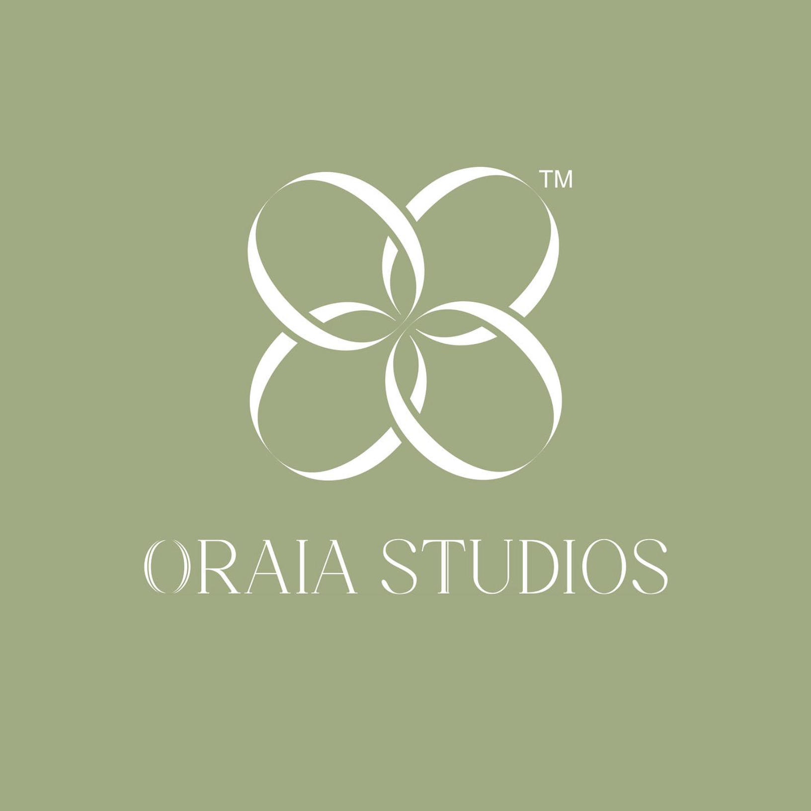 Logo of Oraia Studios with a stylized floral design on a muted green background.