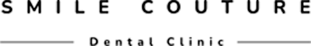 Close-up of a sign reading 'SMILE COUTURE' with additional text below.