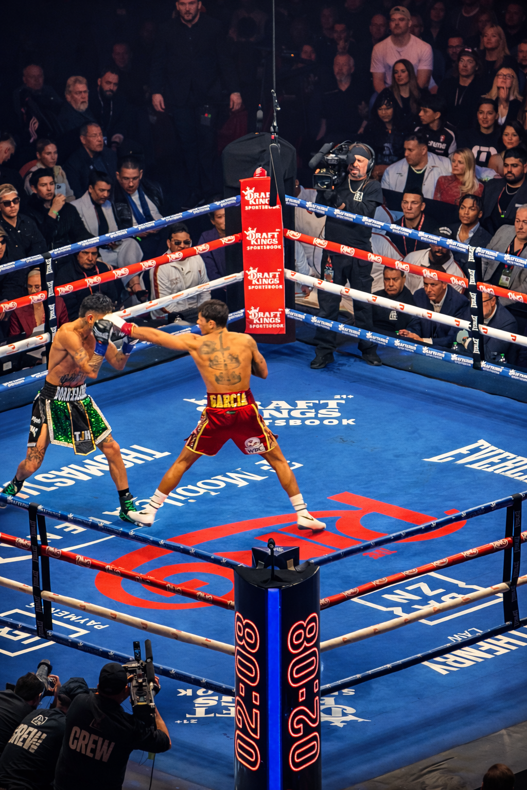 Two male boxers in a boxing ring throwing punches at each other during a match, with an audience watching from the background and cameras capturing the fight.