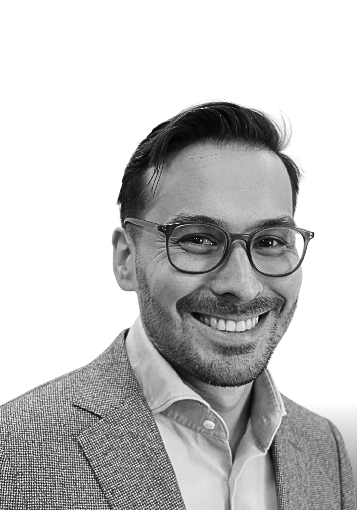 Black and white photo of Timothy Cook, wearing glasses, a suit jacket, and a collared shirt. Strategic Advisor for the Cognitive Privacy Project