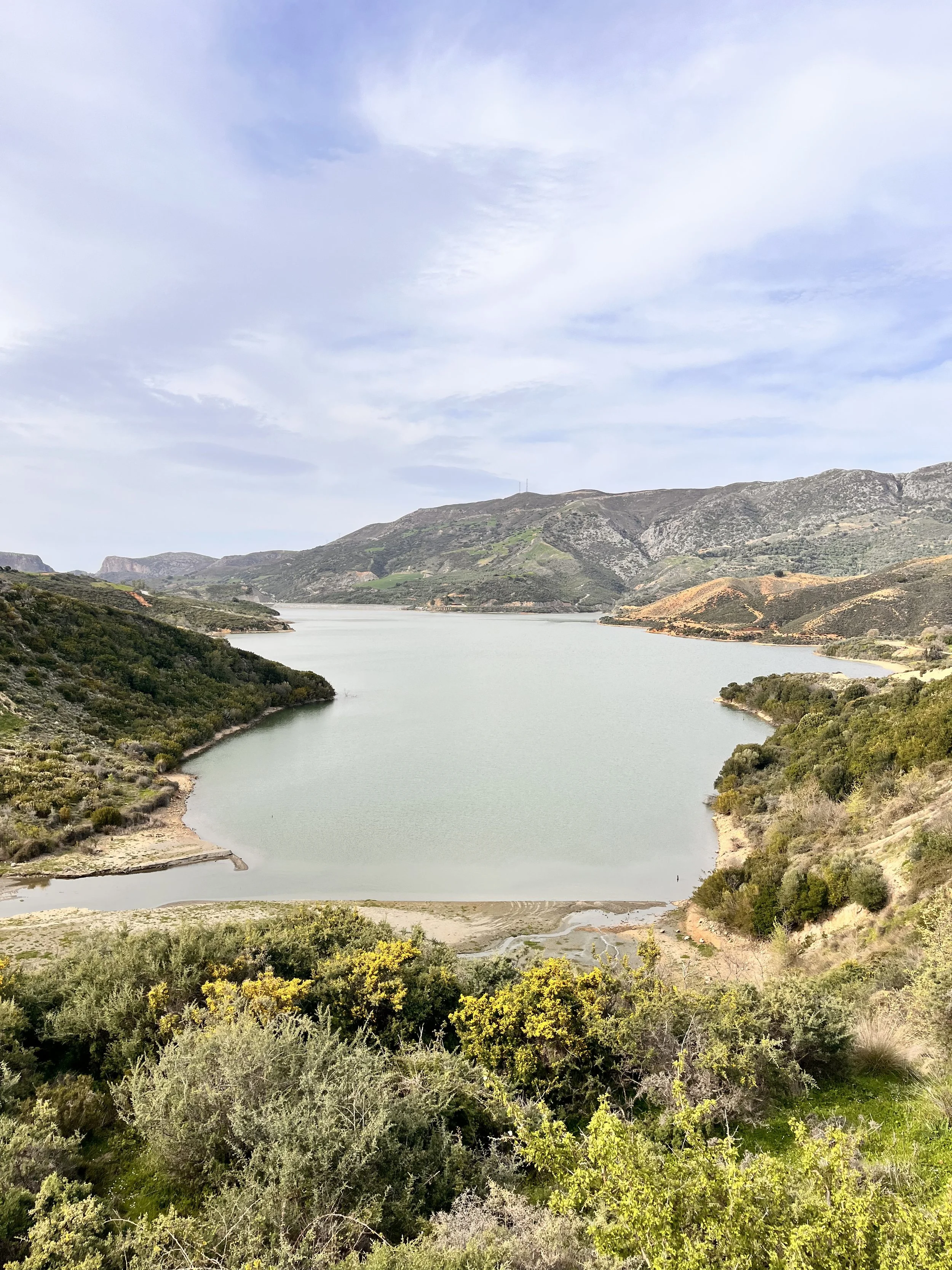 The Amari Dam Reservoir stretches between rolling hills in inland Crete, storing water for agriculture and local communities.