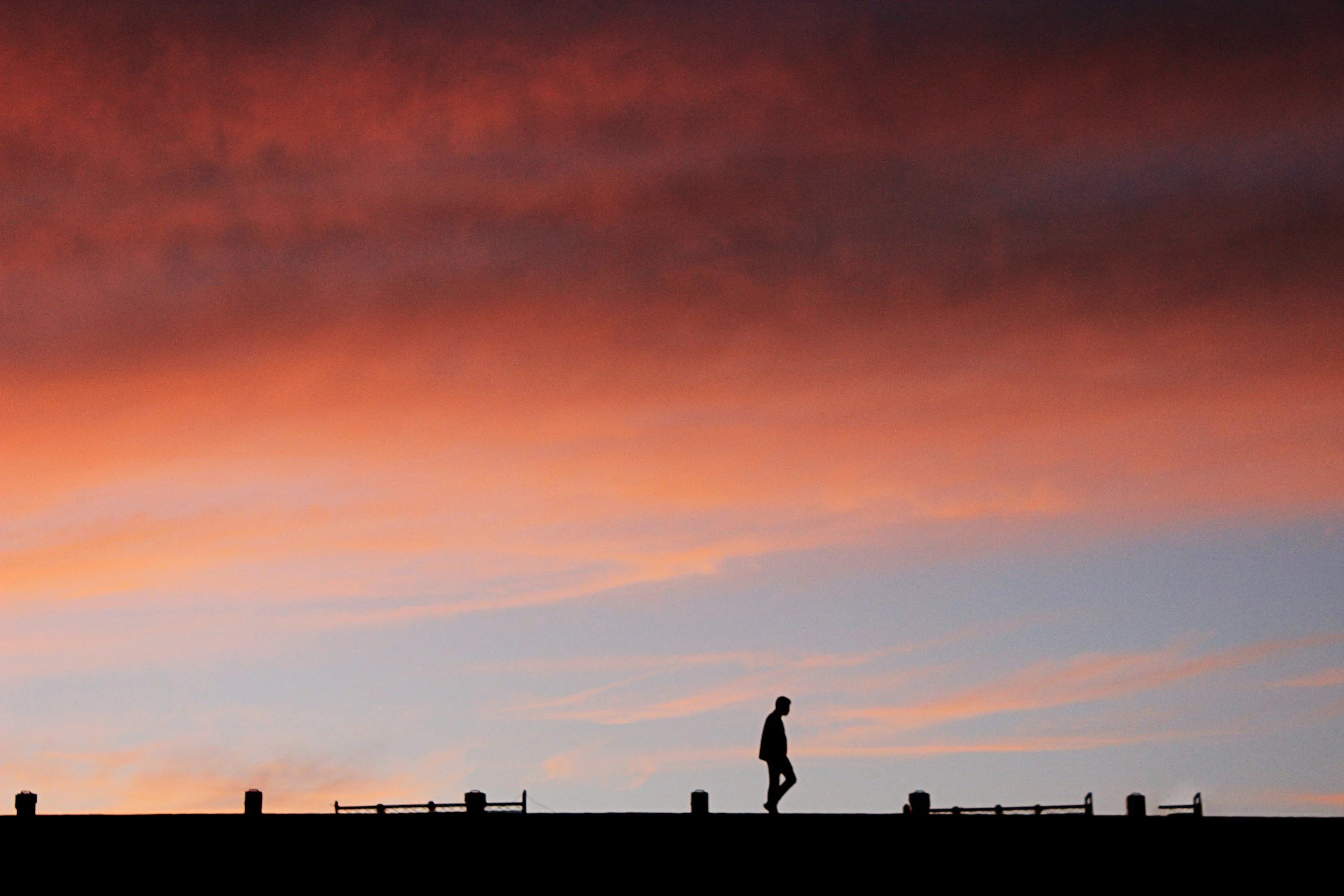 Man walking at sunset in South Crete.
