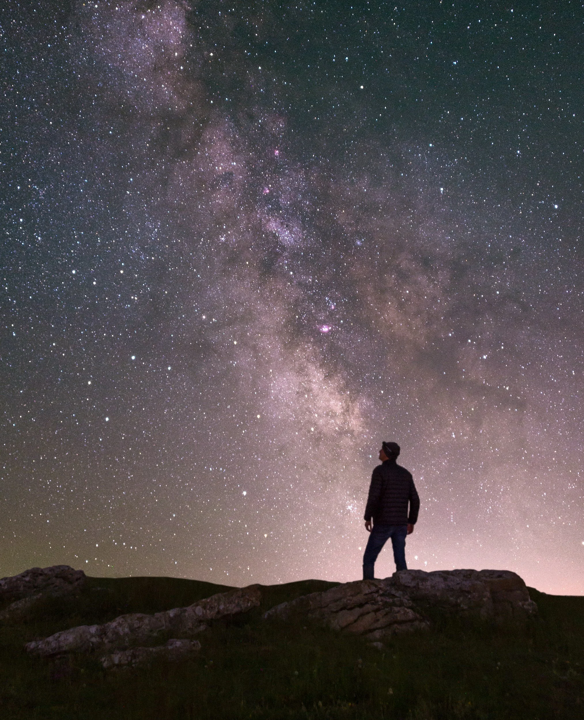 Shadow of a man gazing at stars in the mountains in South Crete.