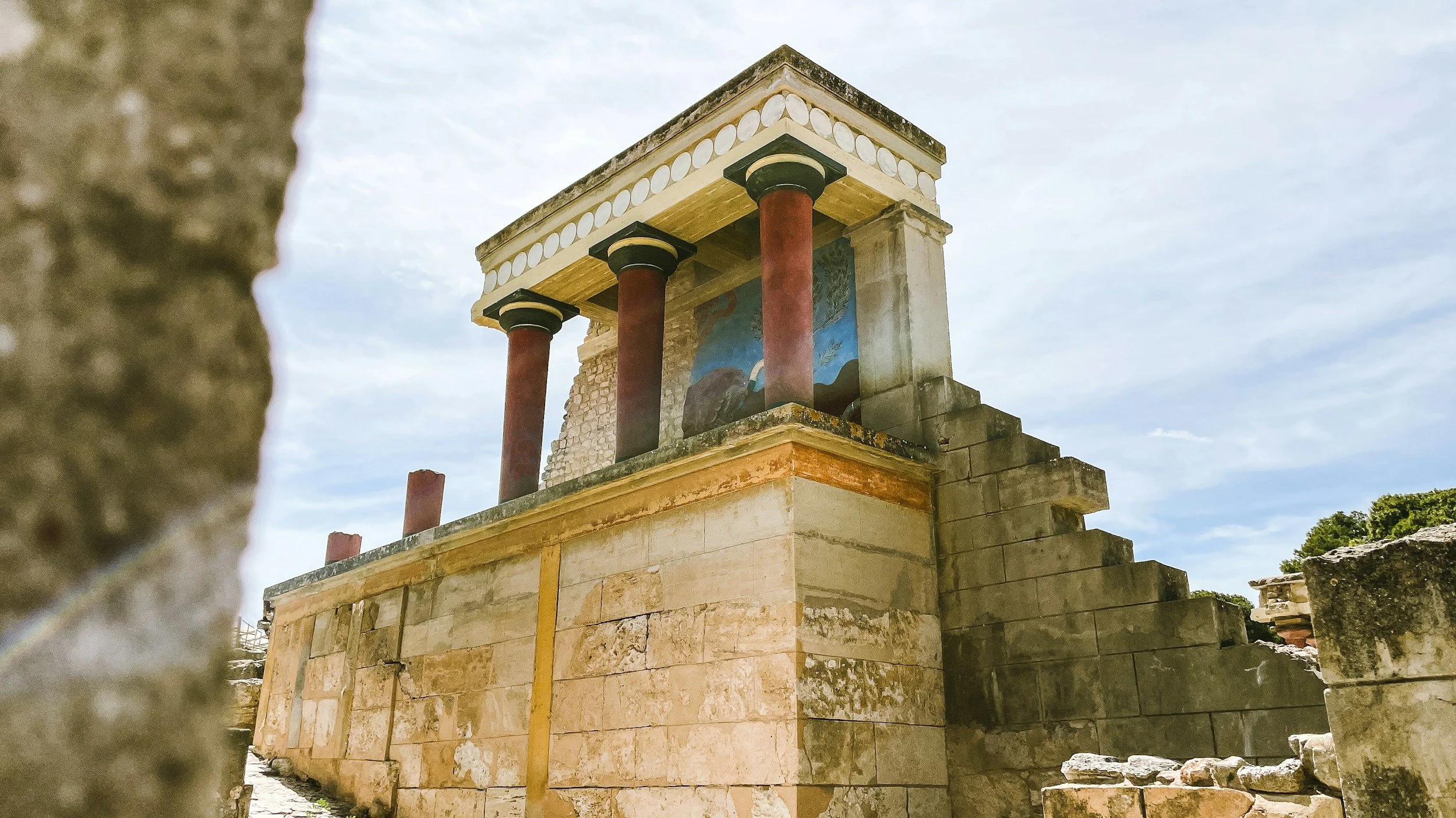 Reconstructed section of the Palace of Knossos showing the characteristic red Minoan columns and ceremonial architecture in Crete.