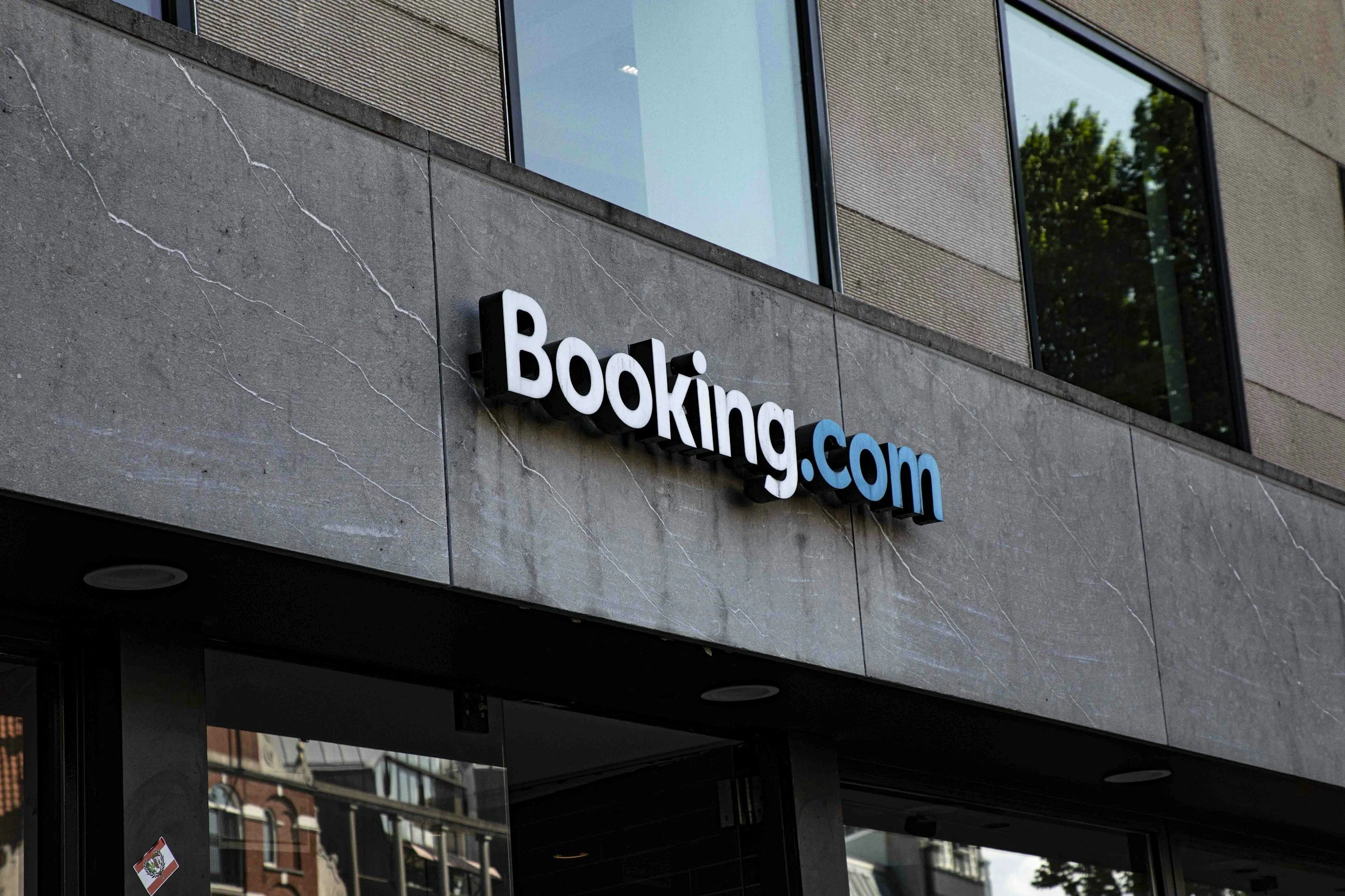The logo of Booking.com in front of a building