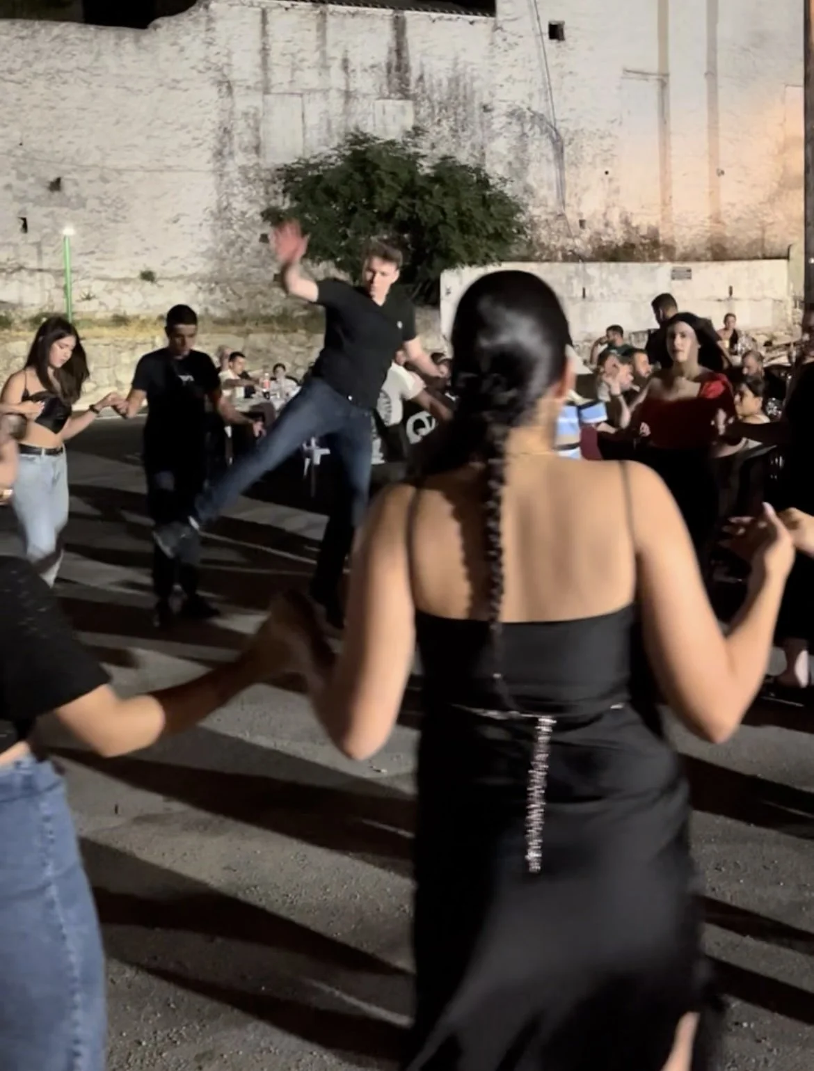Young man jumping during dance at a village festival in Malambes, South Crete.