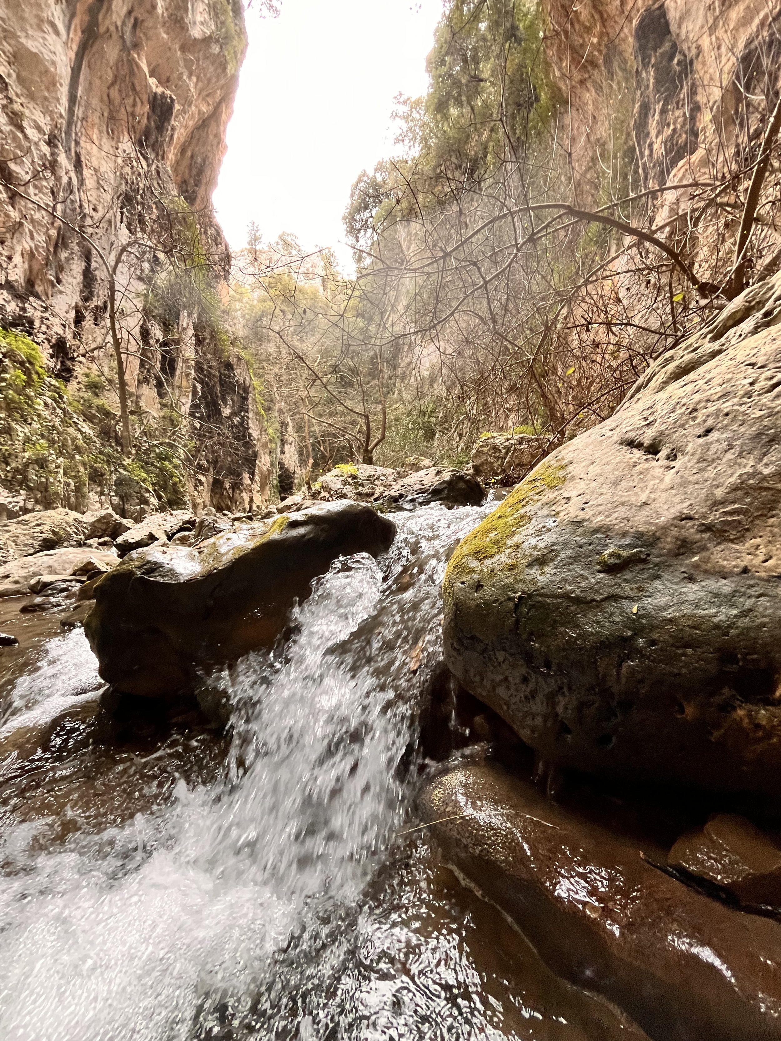 River stream forming a waterfall between the cliffs of Patsos Gorge in Crete.