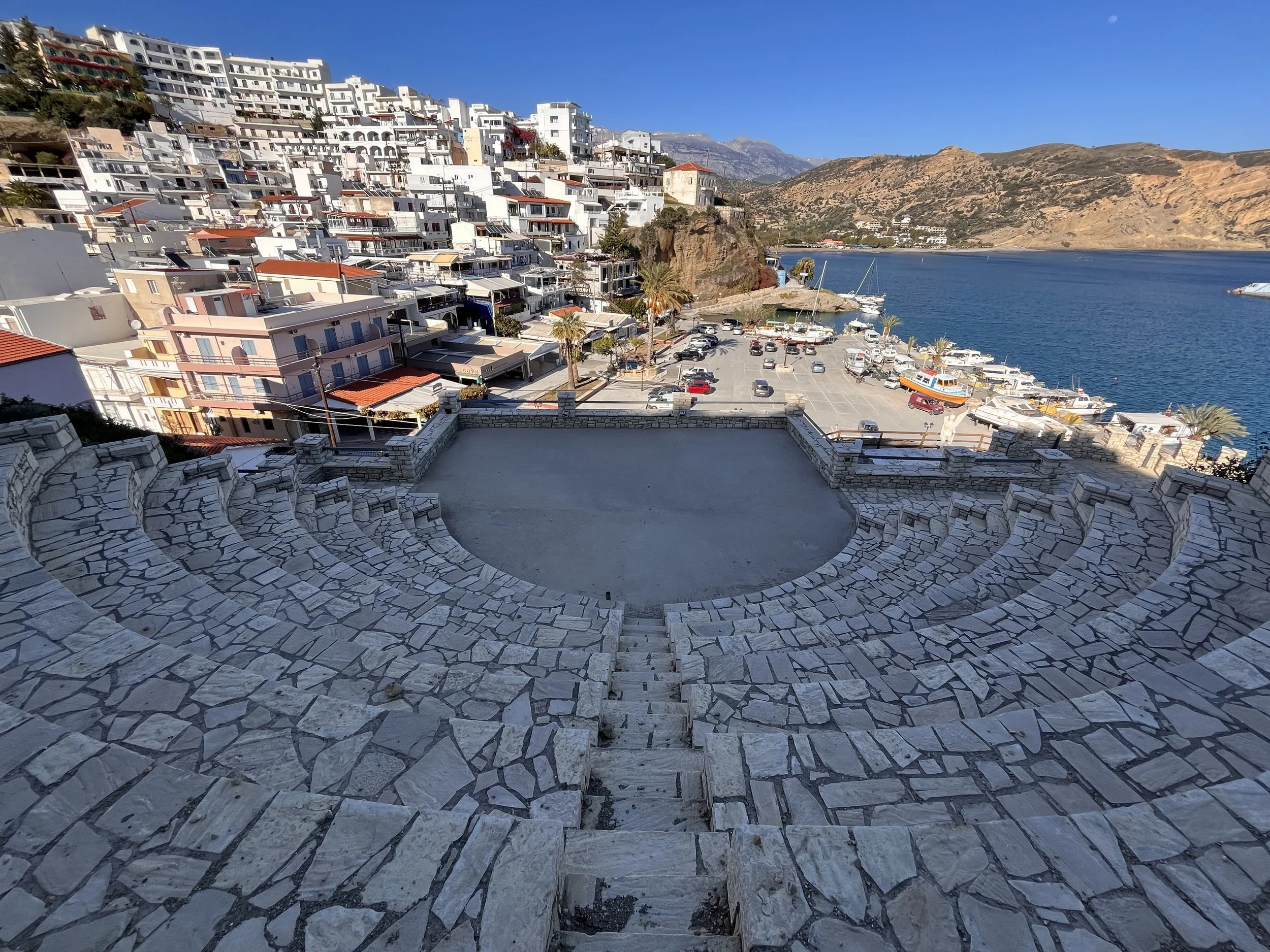 Panoramic view of Agia Galini harbour and village, overlooking the Libyan Sea and the Paximadia Islands off the south coast of Crete.