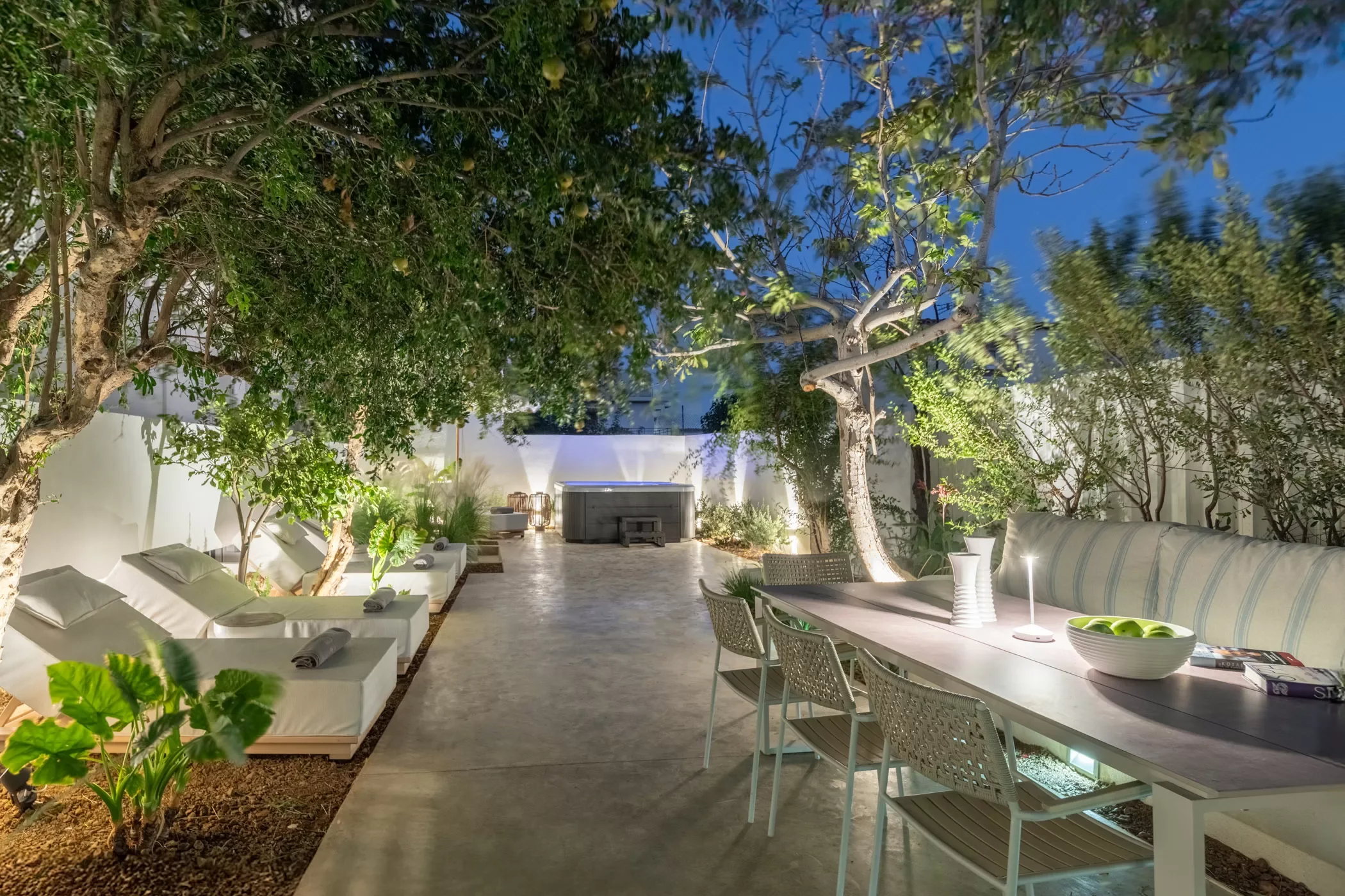 Outdoor patio with lounge chairs and Jacuzzi in Holiday Home near Matala Crete