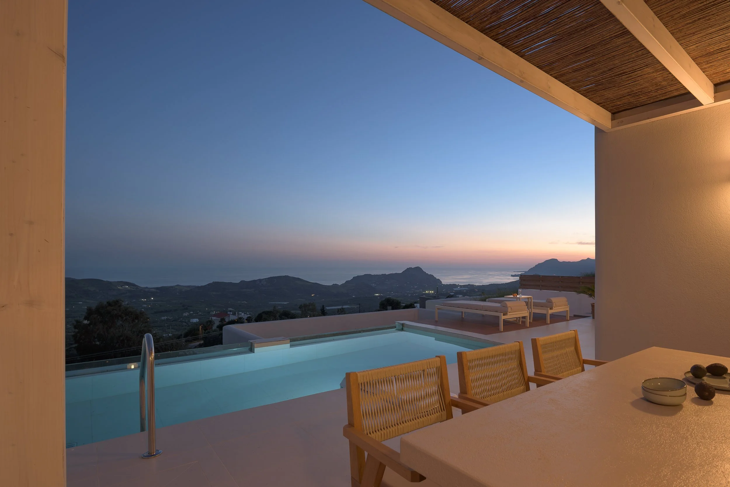 Infinity pool terrace at Aitherion Villa in Asomatos near Plakias, South Crete, with panoramic mountain and sunset views.