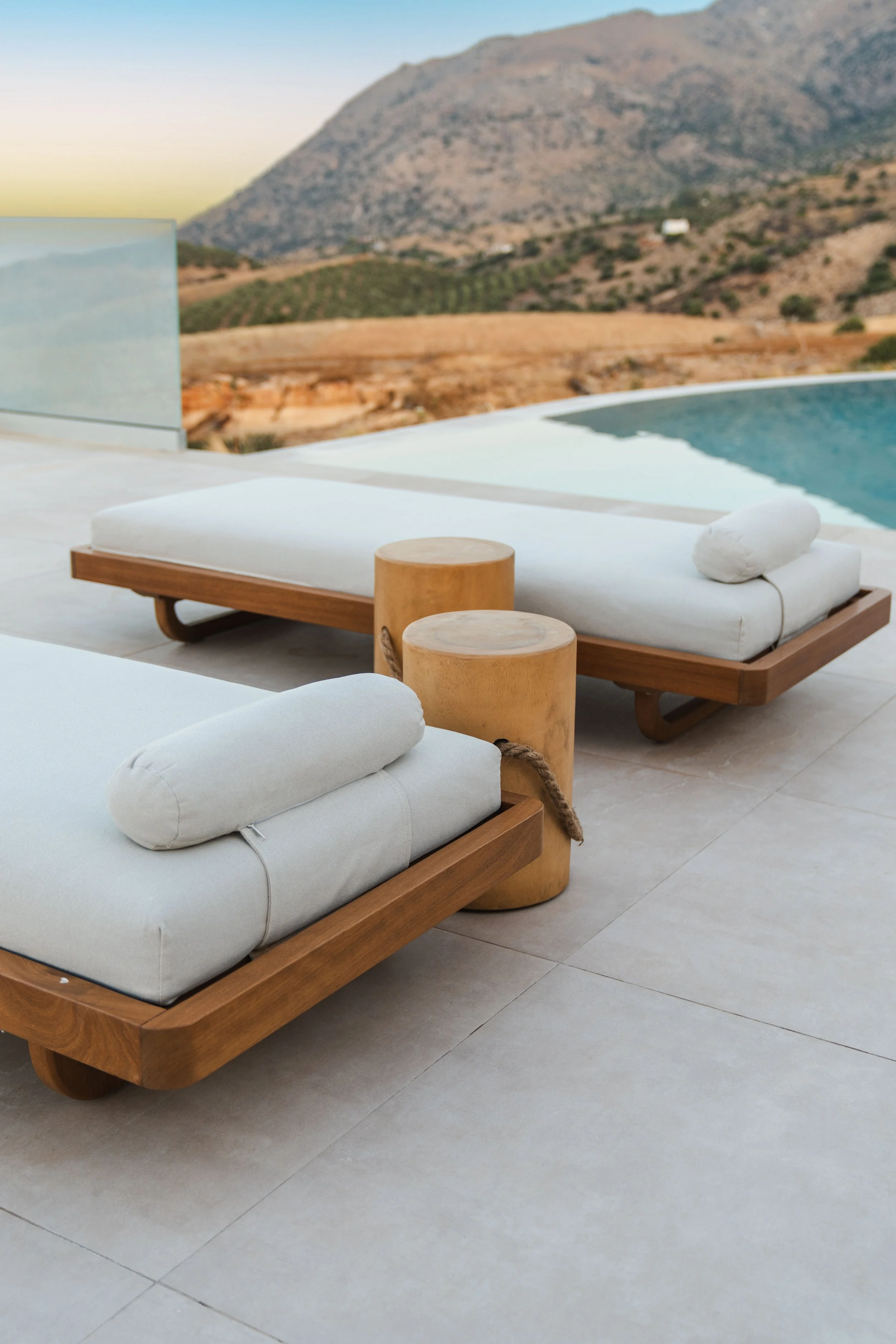 Two sunbeds on the terrace of Keras Cliff House in South Crete overlooking the sea and the Paximadia Islands.