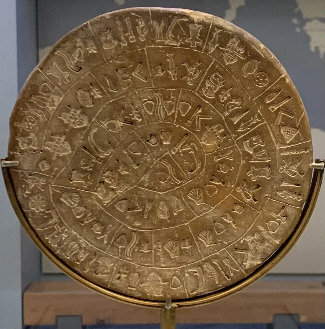 The Phaistos Disc, one of the most famous and mysterious artifacts of Minoan Crete, displayed at the Archaeological Museum of Heraklion