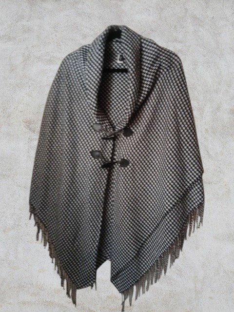 A Black & White, Houndstooth Pattern Poncho With Toggle Buttons