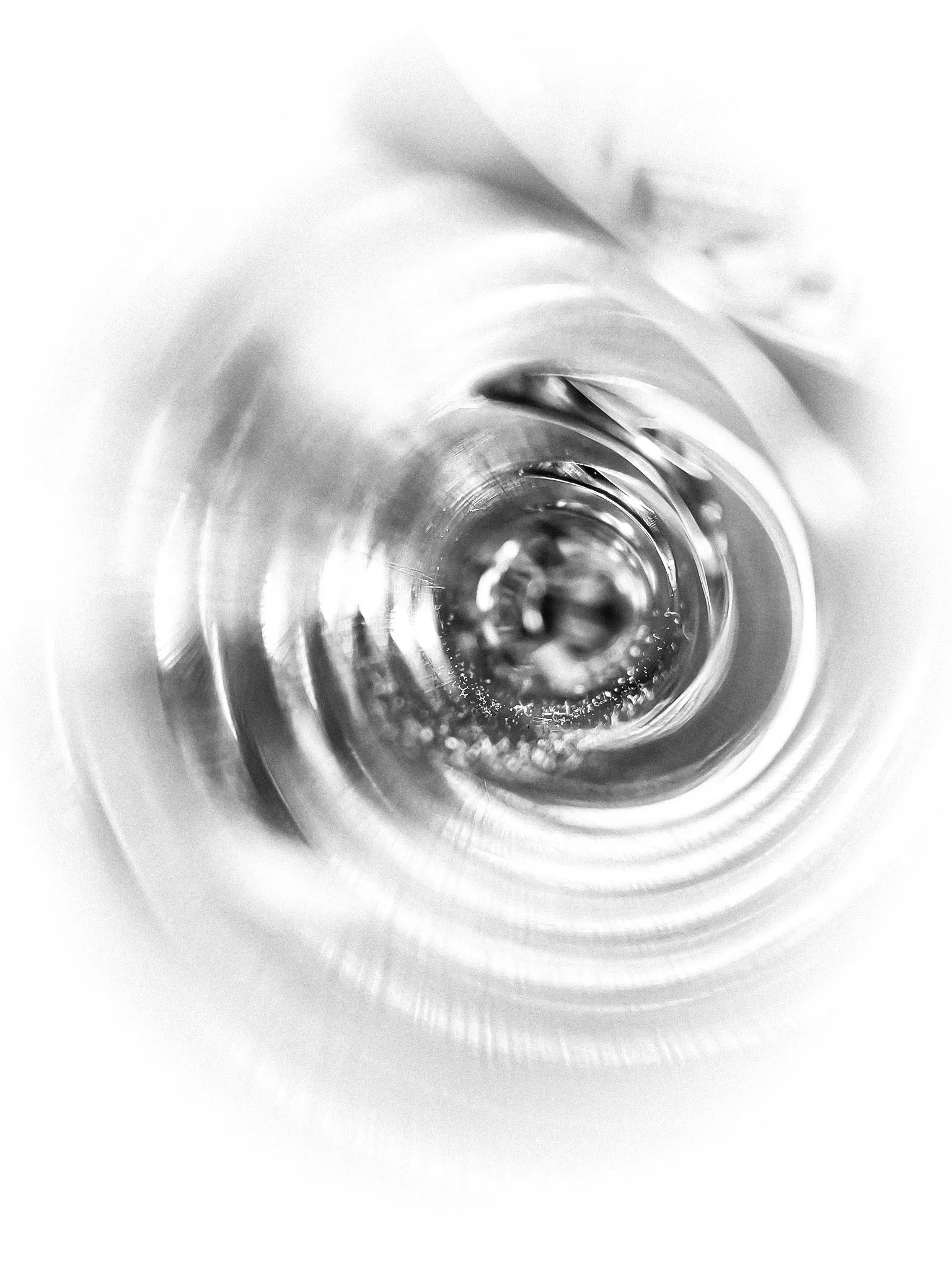 Close-up view of the inside of a flute body showing reflections and toneholes.