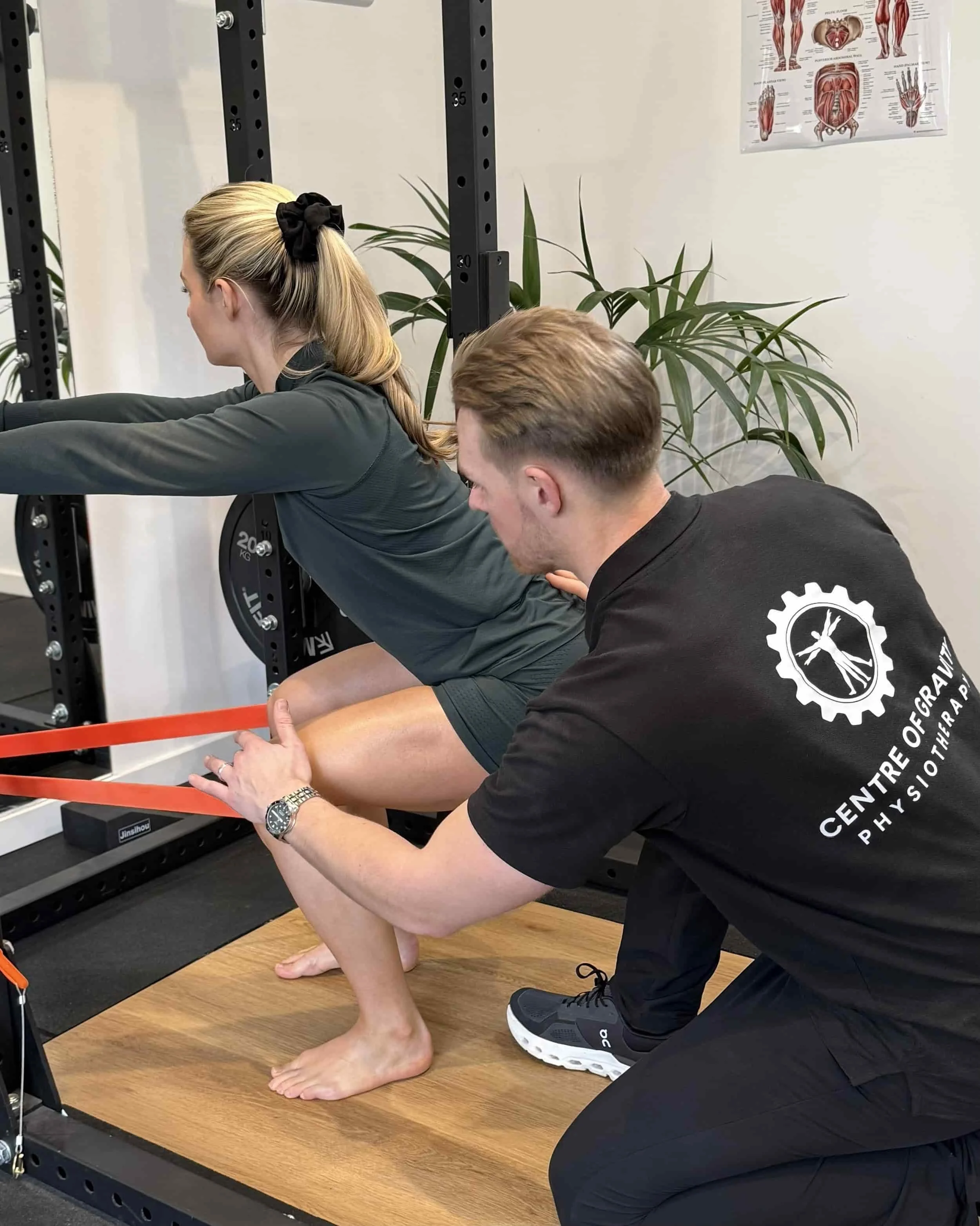 Harry Liniker (Physiotherapist) Teaching a rehab exercise to a patient in COG's modern clinic space