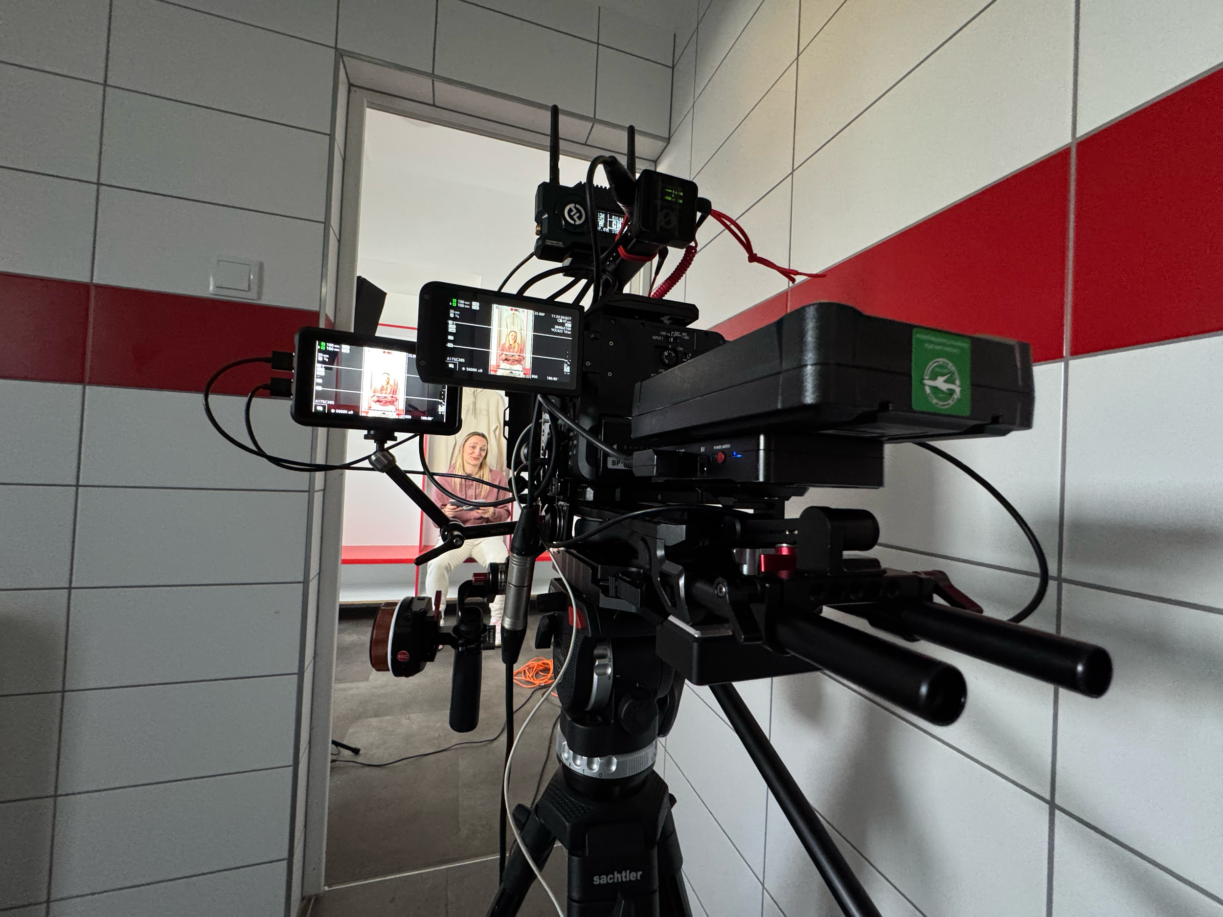ASICS handball production cinema camera rig on tripod in studio with athlete visible in monitor Hungary — social media content production Ballo Studio