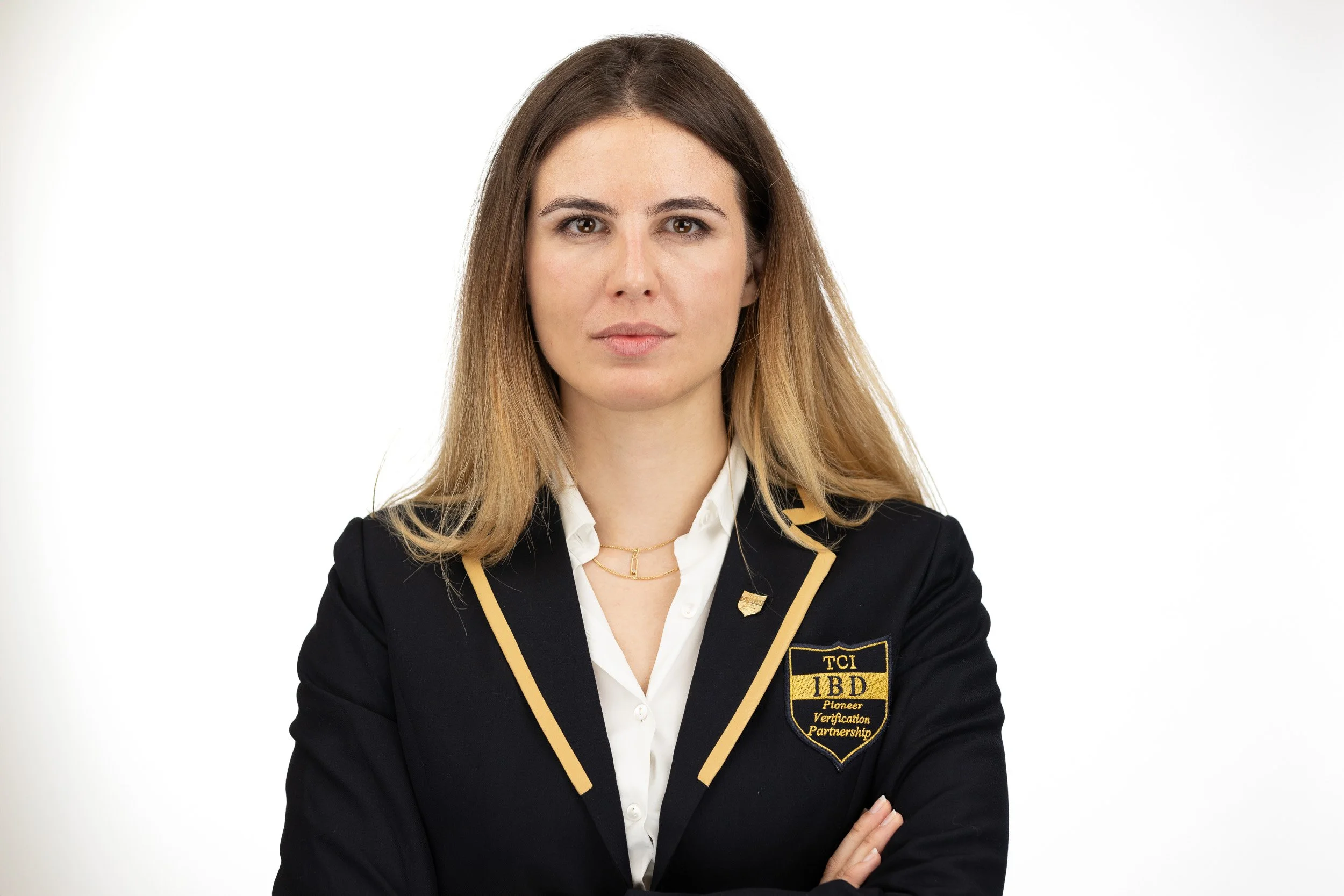 TCI Biotech employee headshot, woman with ombre hair in branded TCI IBD blazer, composed expression — business portrait photography Amsterdam Ballo Studio