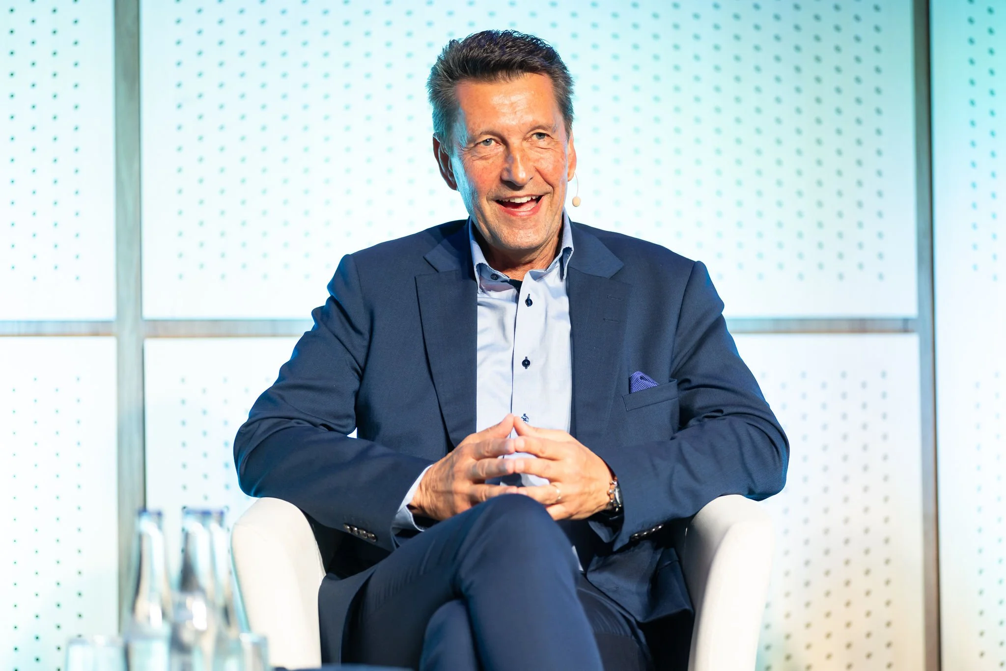 Female panelist seated during conference session at Euroheat & Power Congress Amsterdam — event photographer Amsterdam Ballo Studio