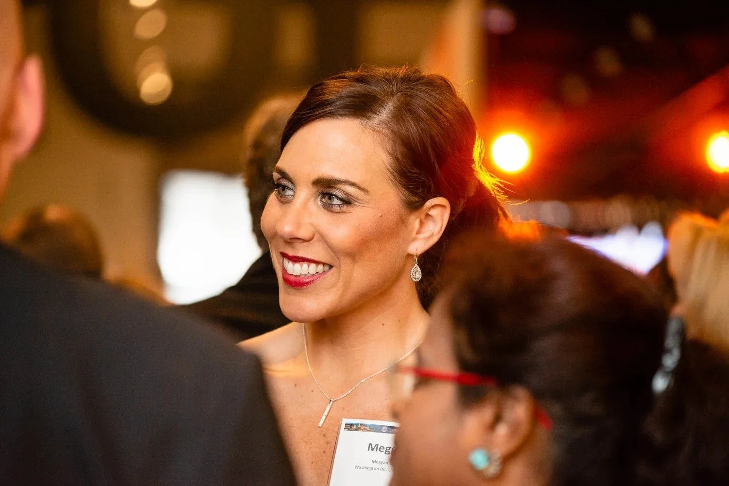 Delegate smiling warmly at corporate gala dinner networking reception Amsterdam — event photography Amsterdam Ballo Studio